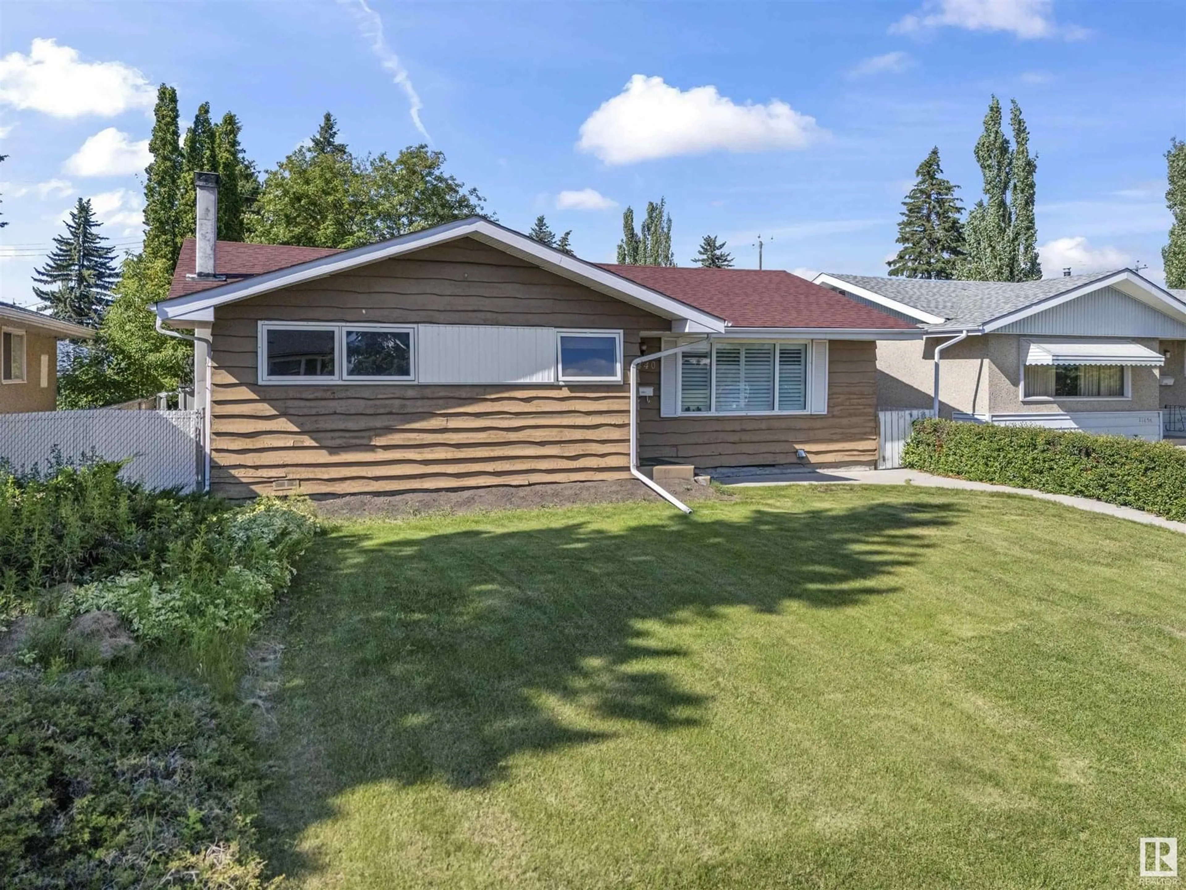 Home with vinyl exterior material, street for 11440 MALMO RD, Edmonton Alberta T6H4M2