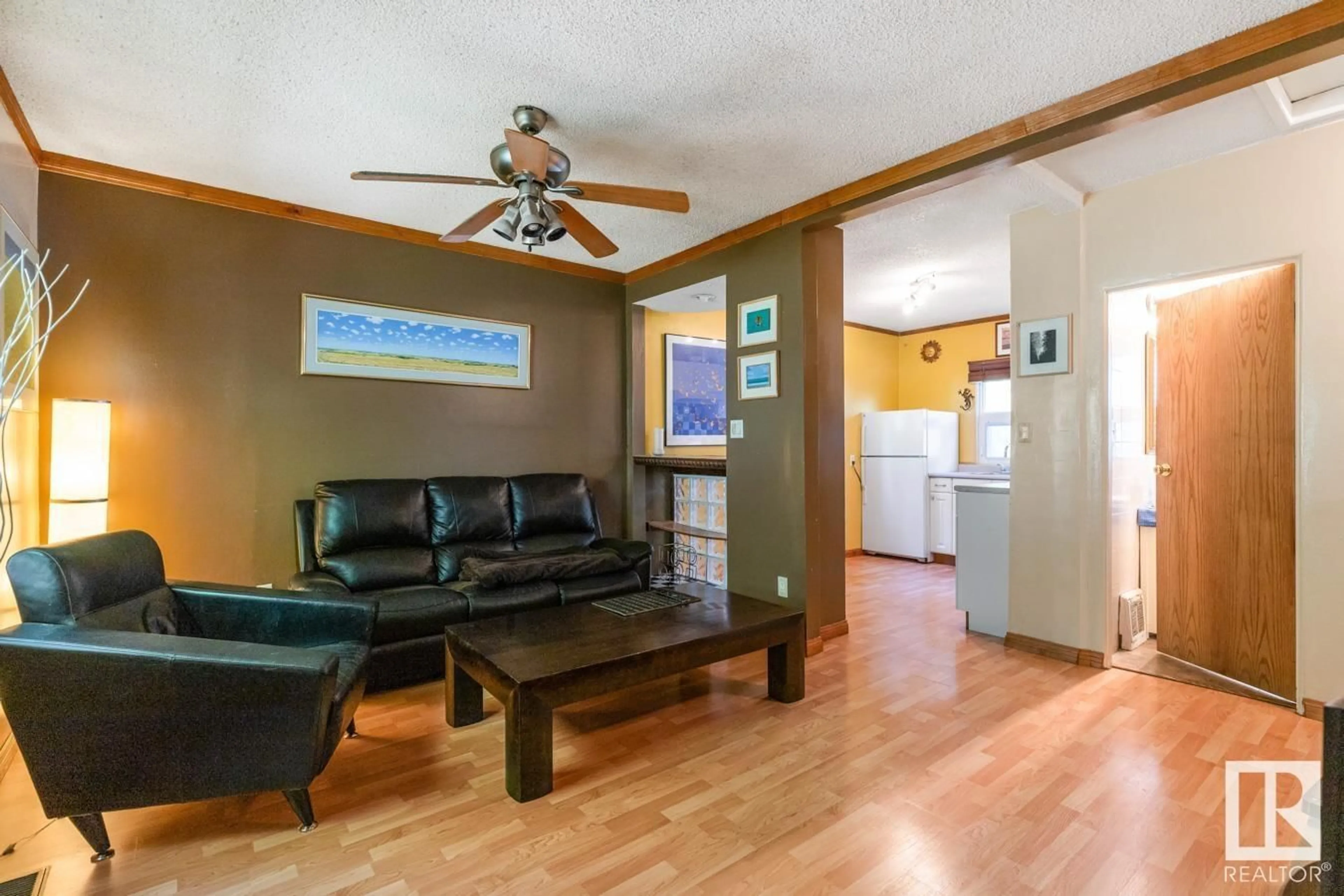Living room with furniture, wood/laminate floor for 11211 72 AV, Edmonton Alberta T6G0B4