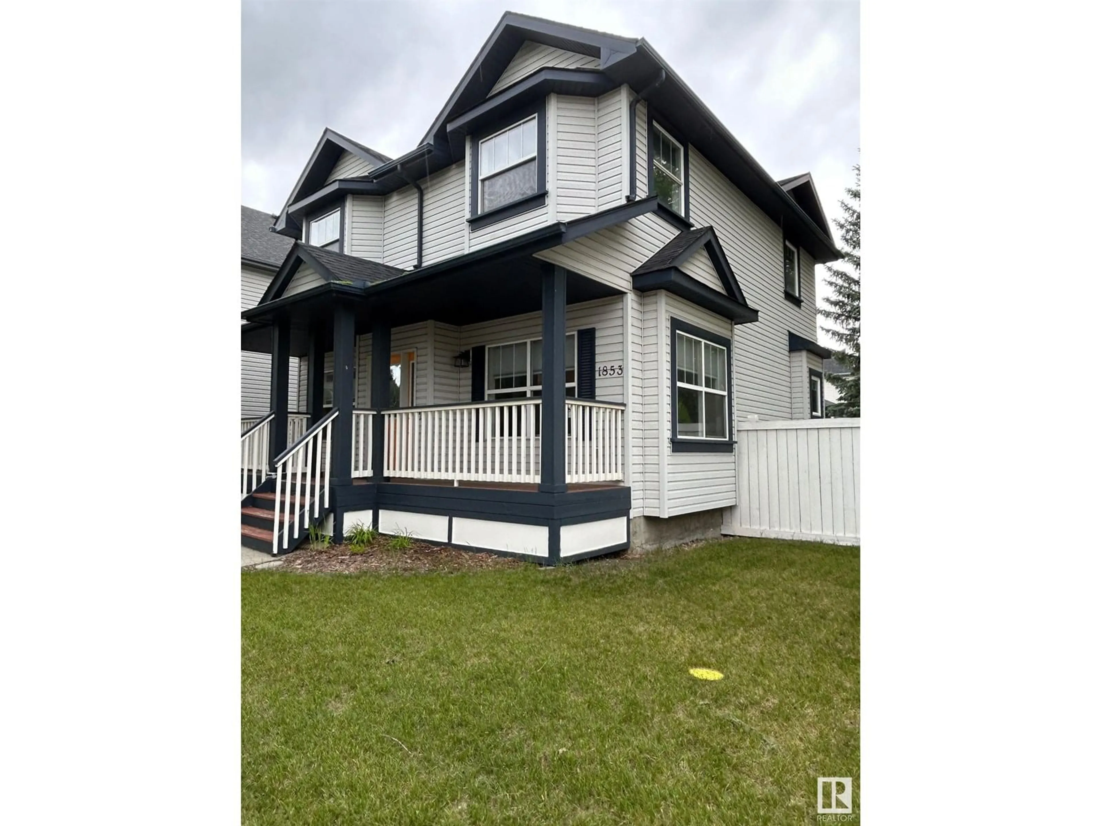 Home with vinyl exterior material, street for 1853 TOMLINSON WY, Edmonton Alberta T5R2W5