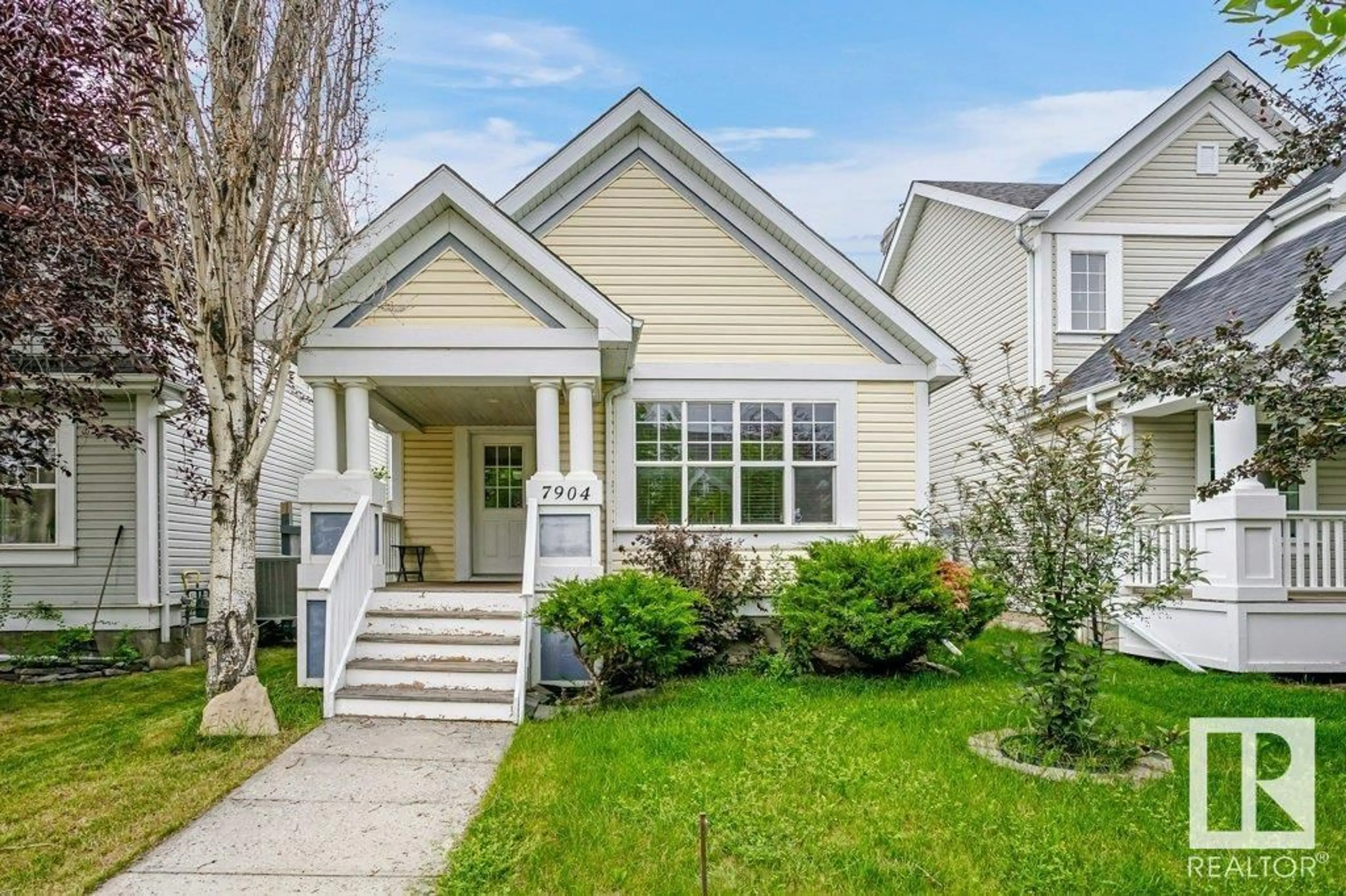 Home with vinyl exterior material, street for 7904 12 AV, Edmonton Alberta T6X1E8