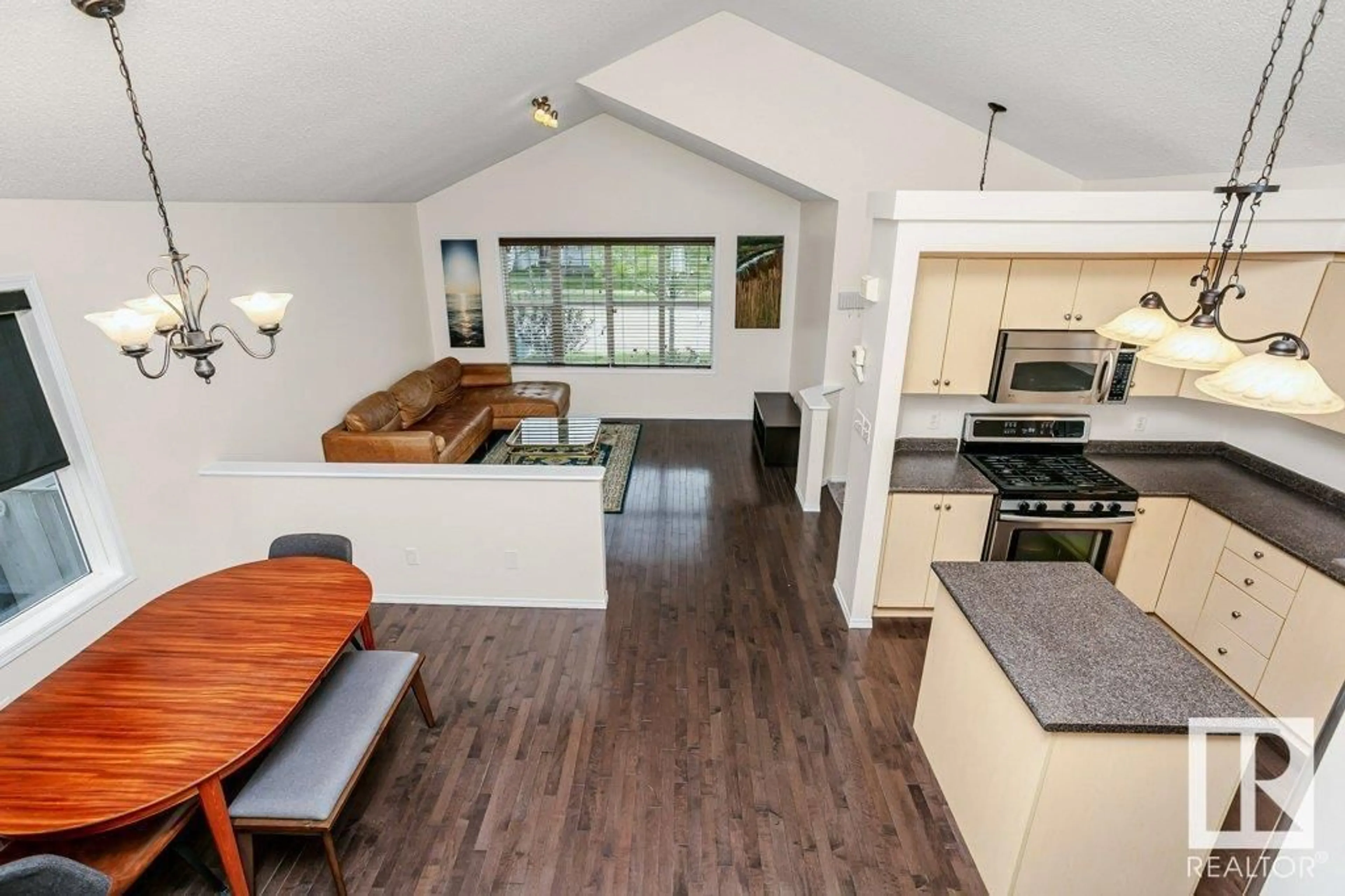 Open concept kitchen, wood/laminate floor for 7904 12 AV, Edmonton Alberta T6X1E8