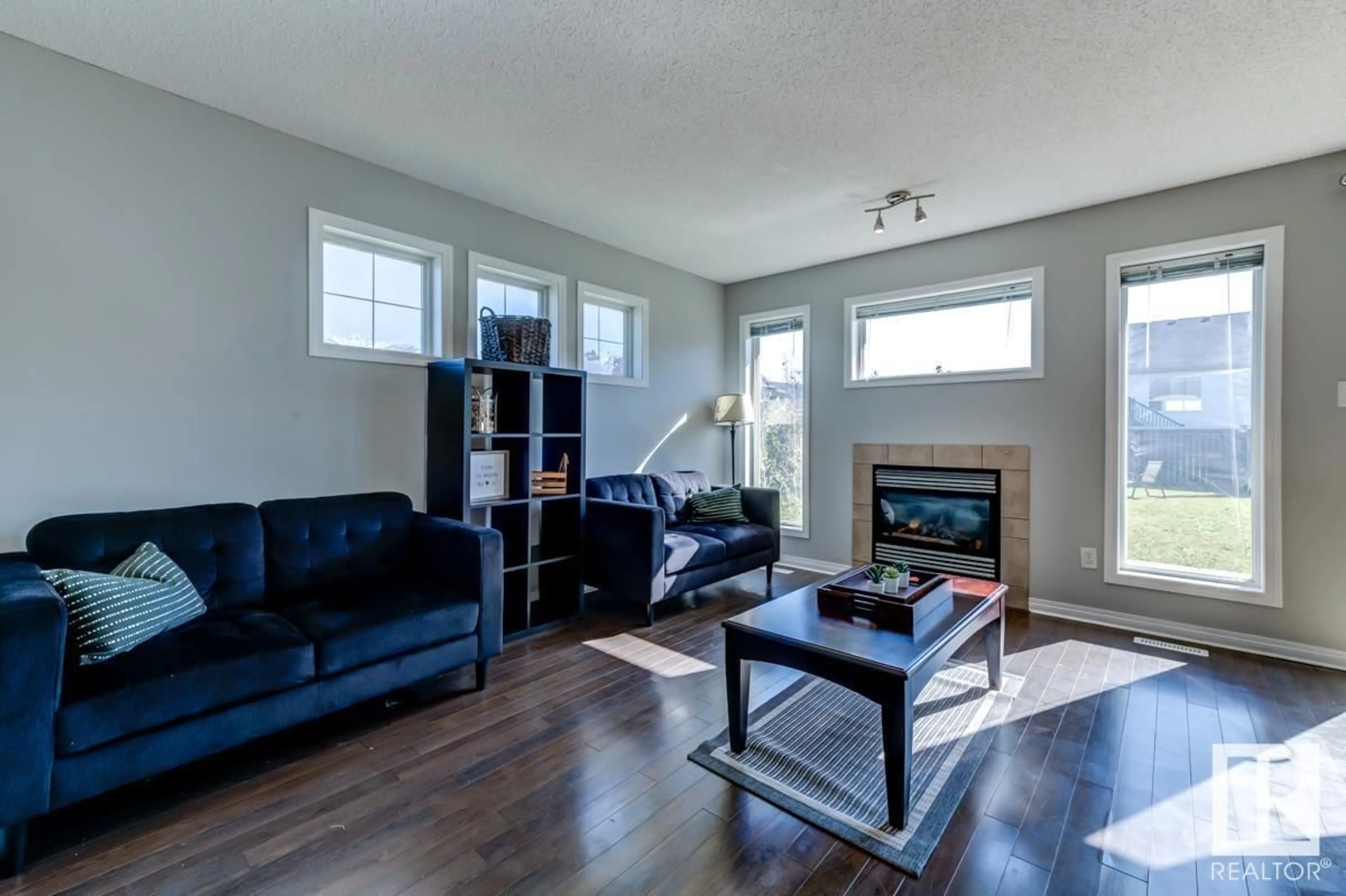 Living room with furniture, wood/laminate floor for 603 62 ST, Edmonton Alberta T6X0G1