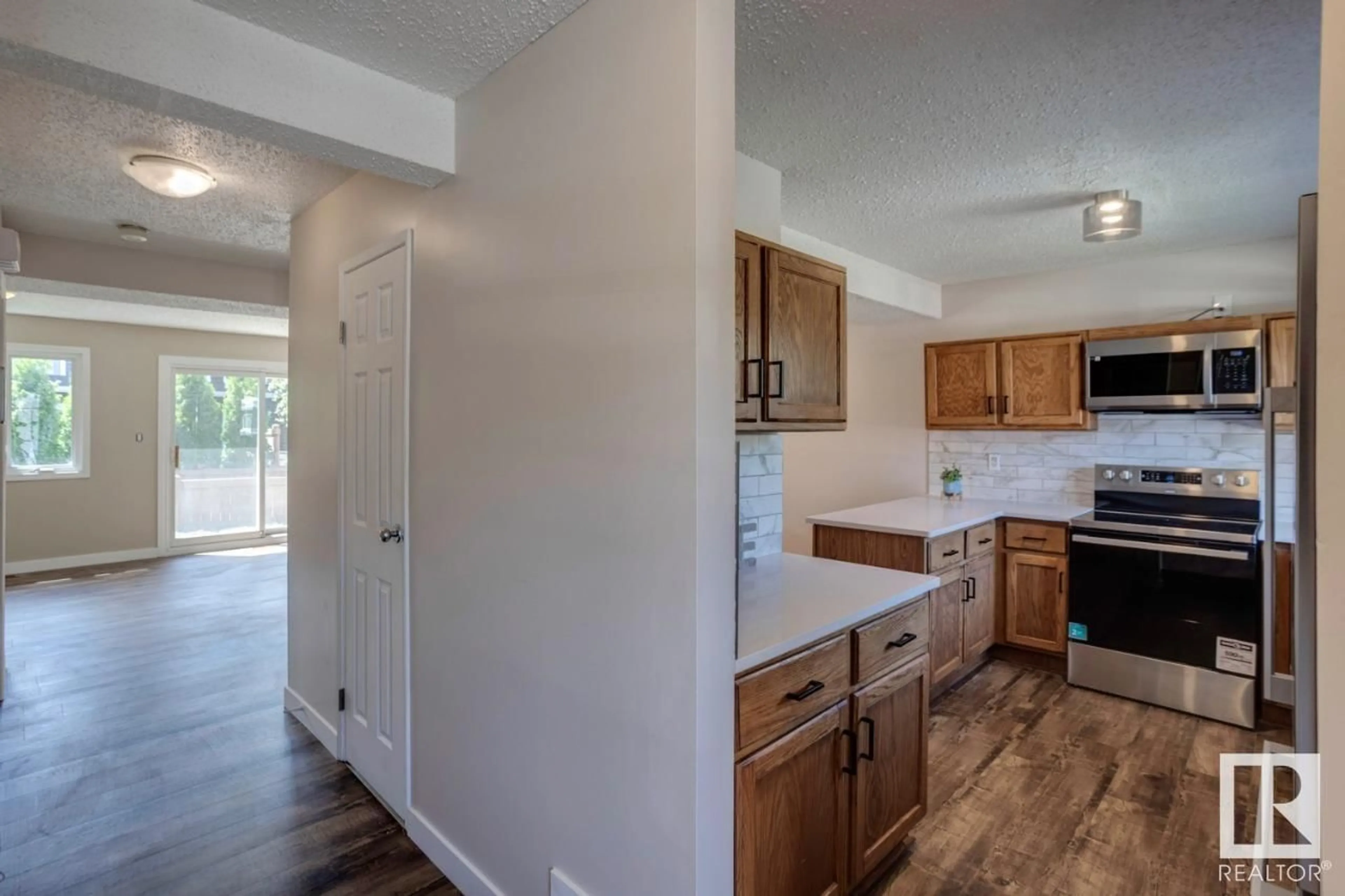 Open concept kitchen, wood/laminate floor for 47 - 3115 119 ST, Edmonton Alberta T6J5N5