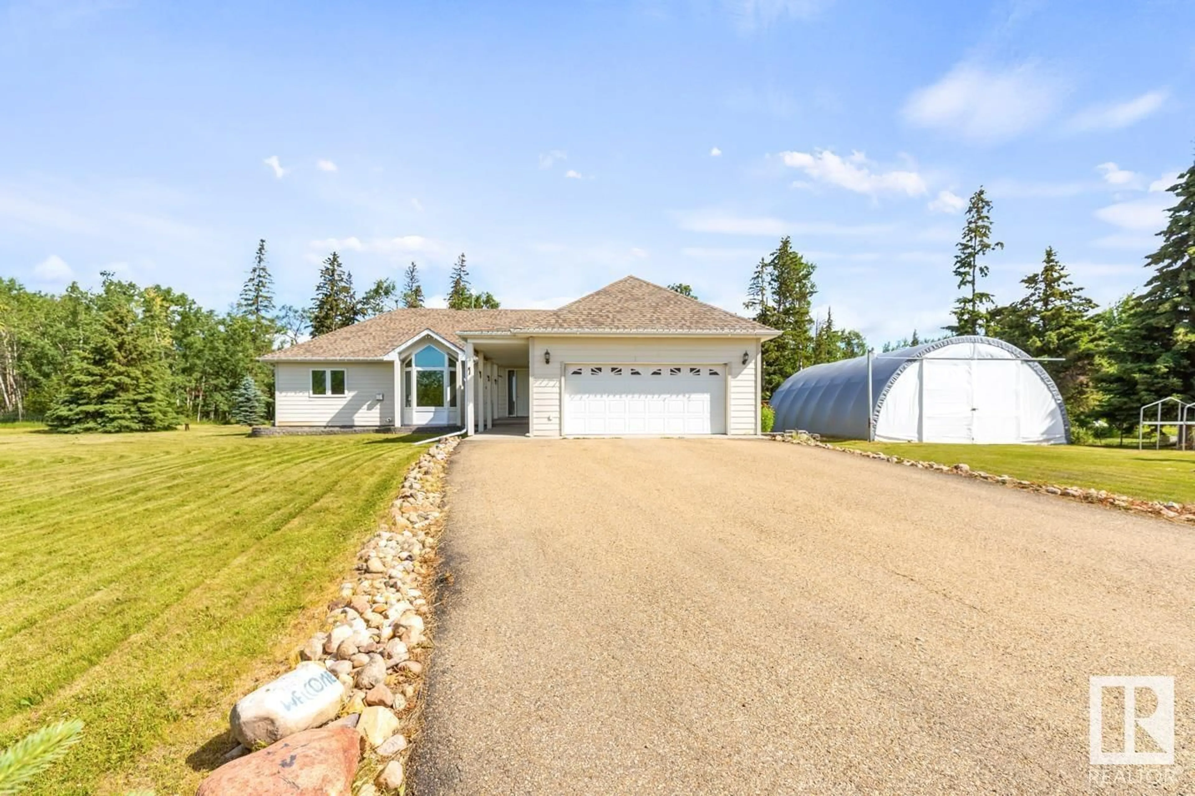 A pic from outside/outdoor area/front of a property/back of a property/a pic from drone, water/lake/river/ocean view for 14 - 255041 TWP ROAD 472, Rural Wetaskiwin County Alberta T0C1Z0