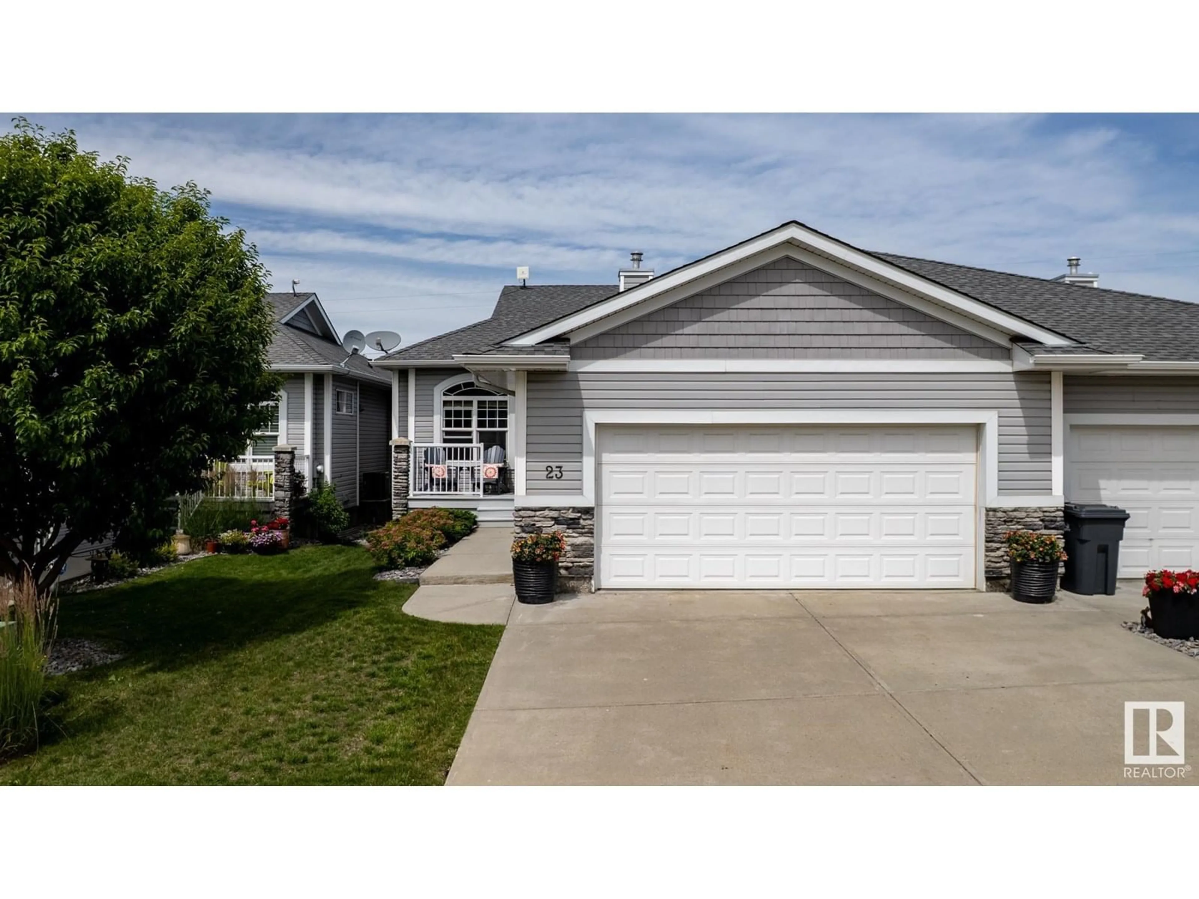 Home with vinyl exterior material, street for 23 - 26116A HWY 16, Rural Parkland County Alberta T7Y1A1