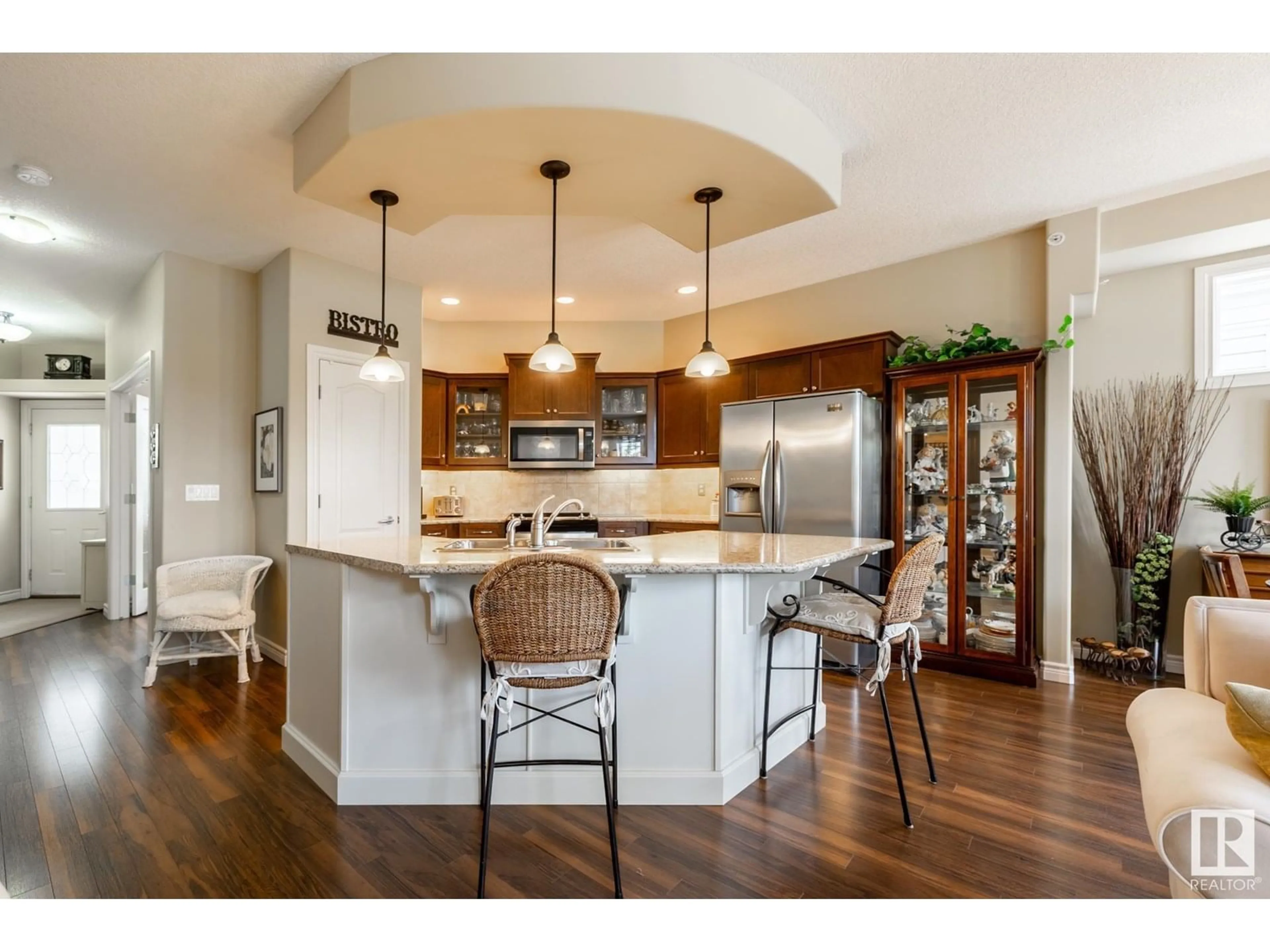 Open concept kitchen, wood/laminate floor for 23 - 26116A HWY 16, Rural Parkland County Alberta T7Y1A1