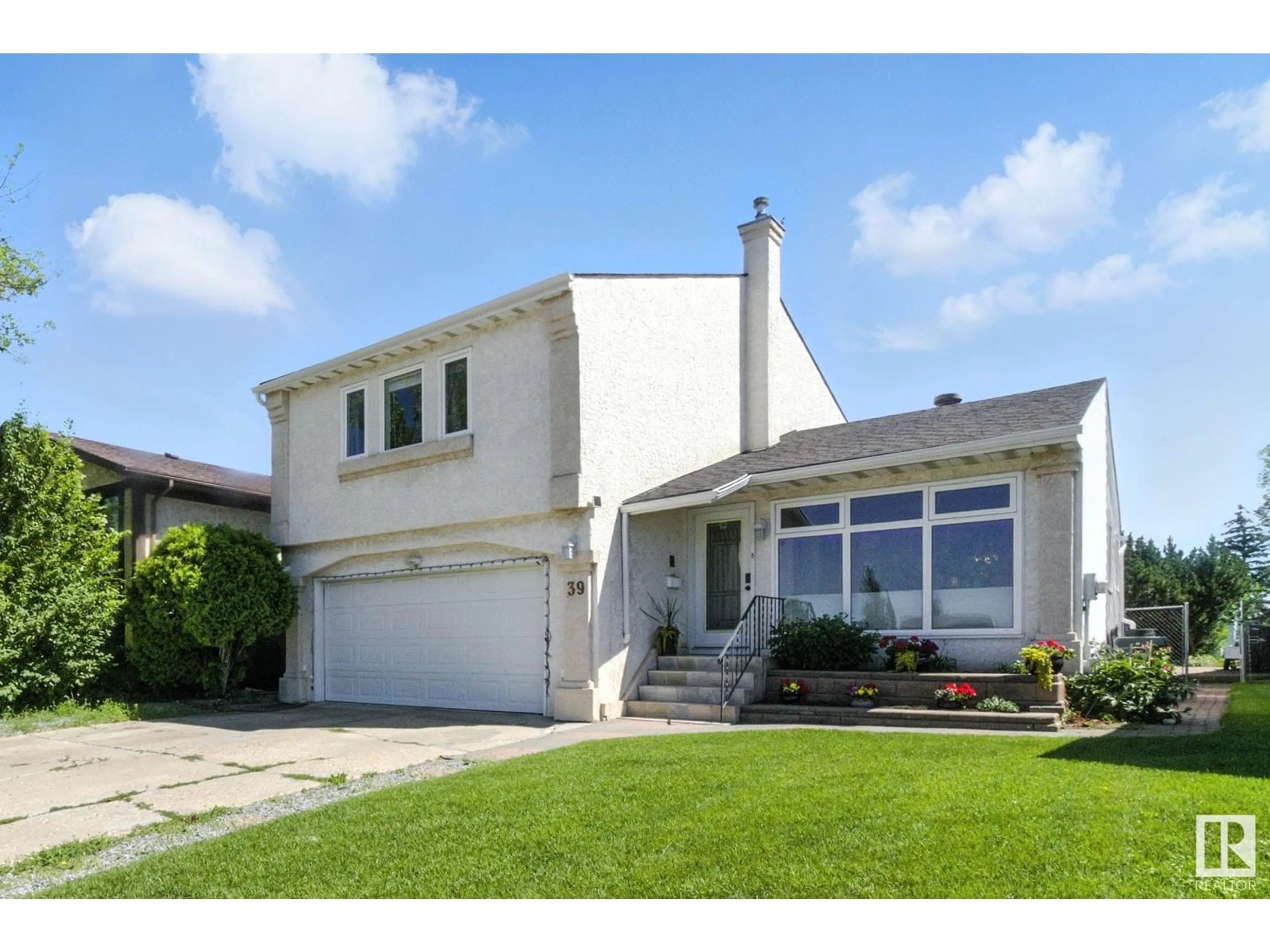 Home with vinyl exterior material, street for 39 GRAND MEADOW CR, Edmonton Alberta T6L1A3
