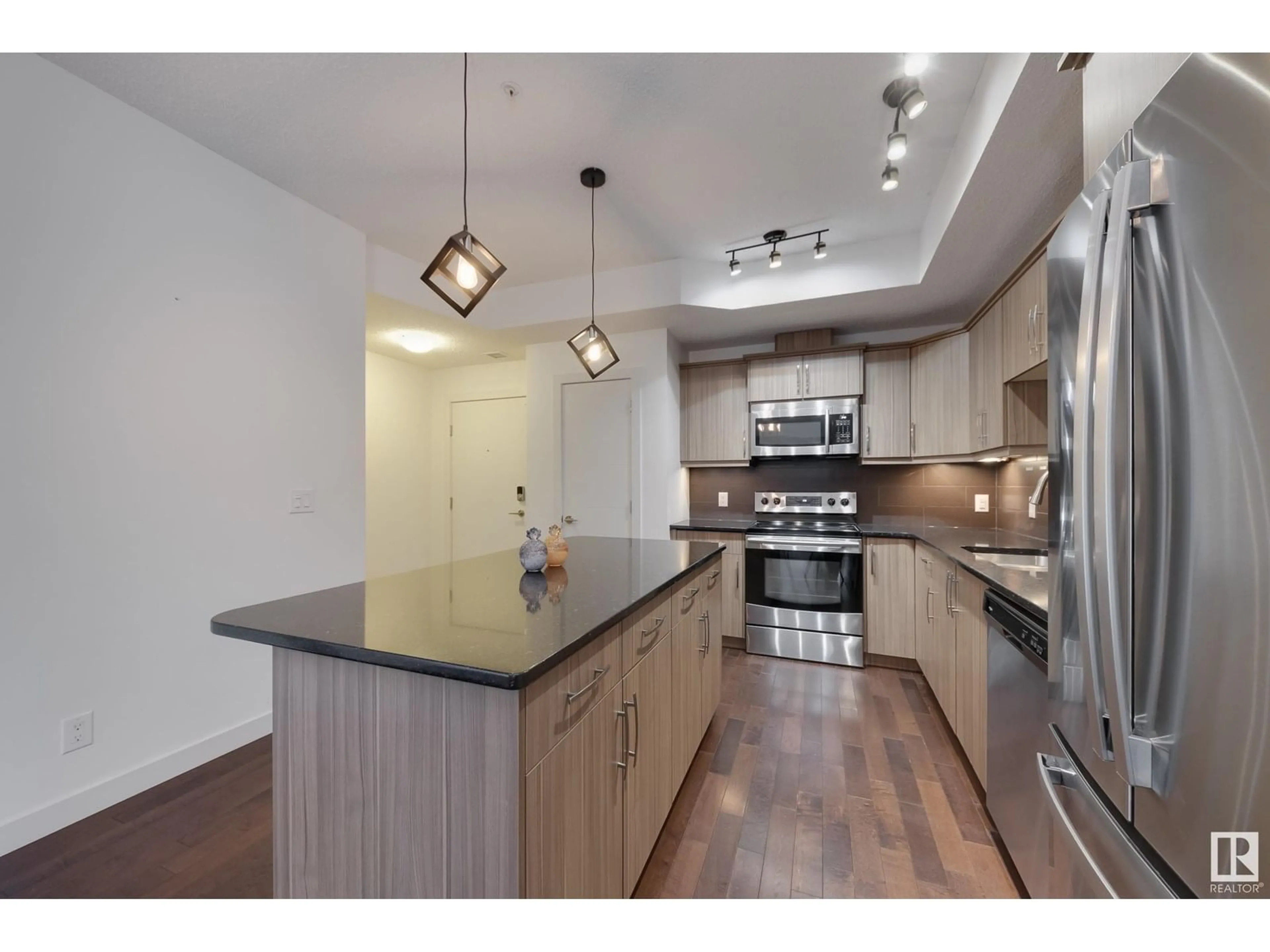 Open concept kitchen, unknown for #115 - 10523 123 ST, Edmonton Alberta T5N1N9