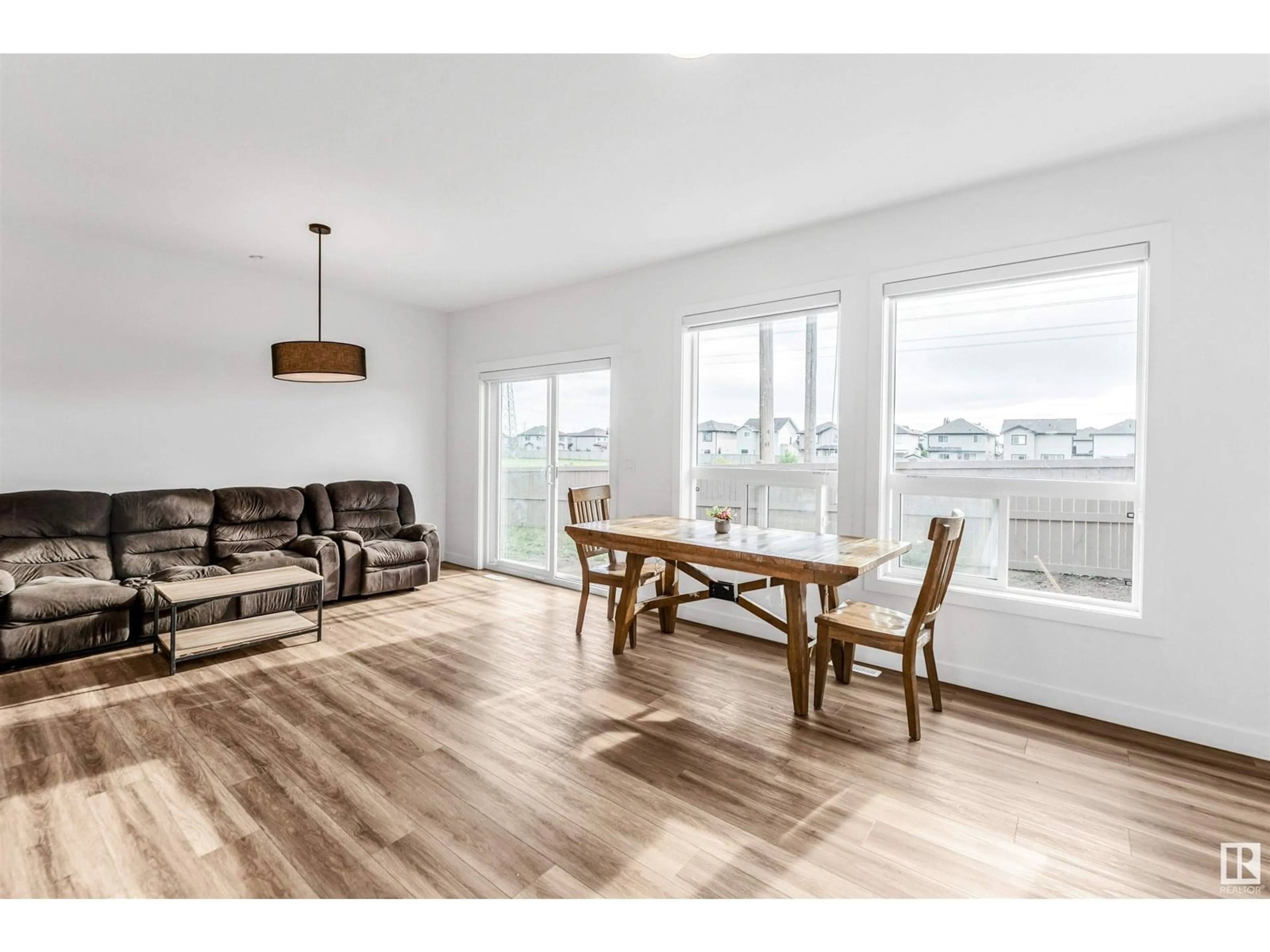 Living room with furniture, wood/laminate floor for NW - 1544 27 ST, Edmonton Alberta T6T2T7