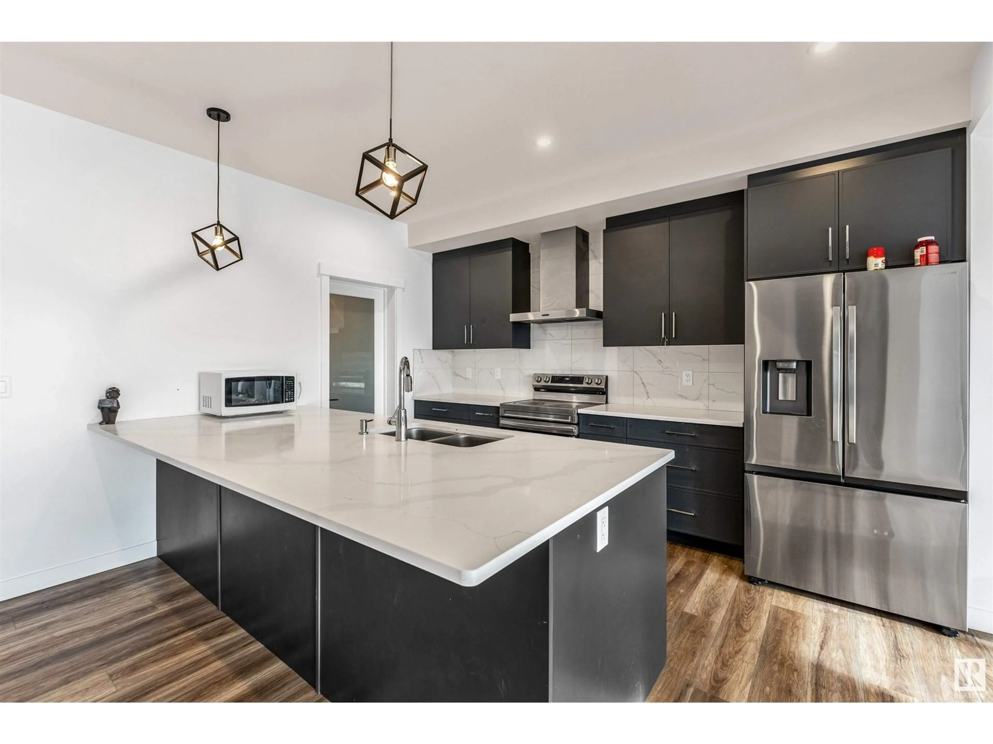 Open concept kitchen, unknown for NW - 1544 27 ST, Edmonton Alberta T6T2T7