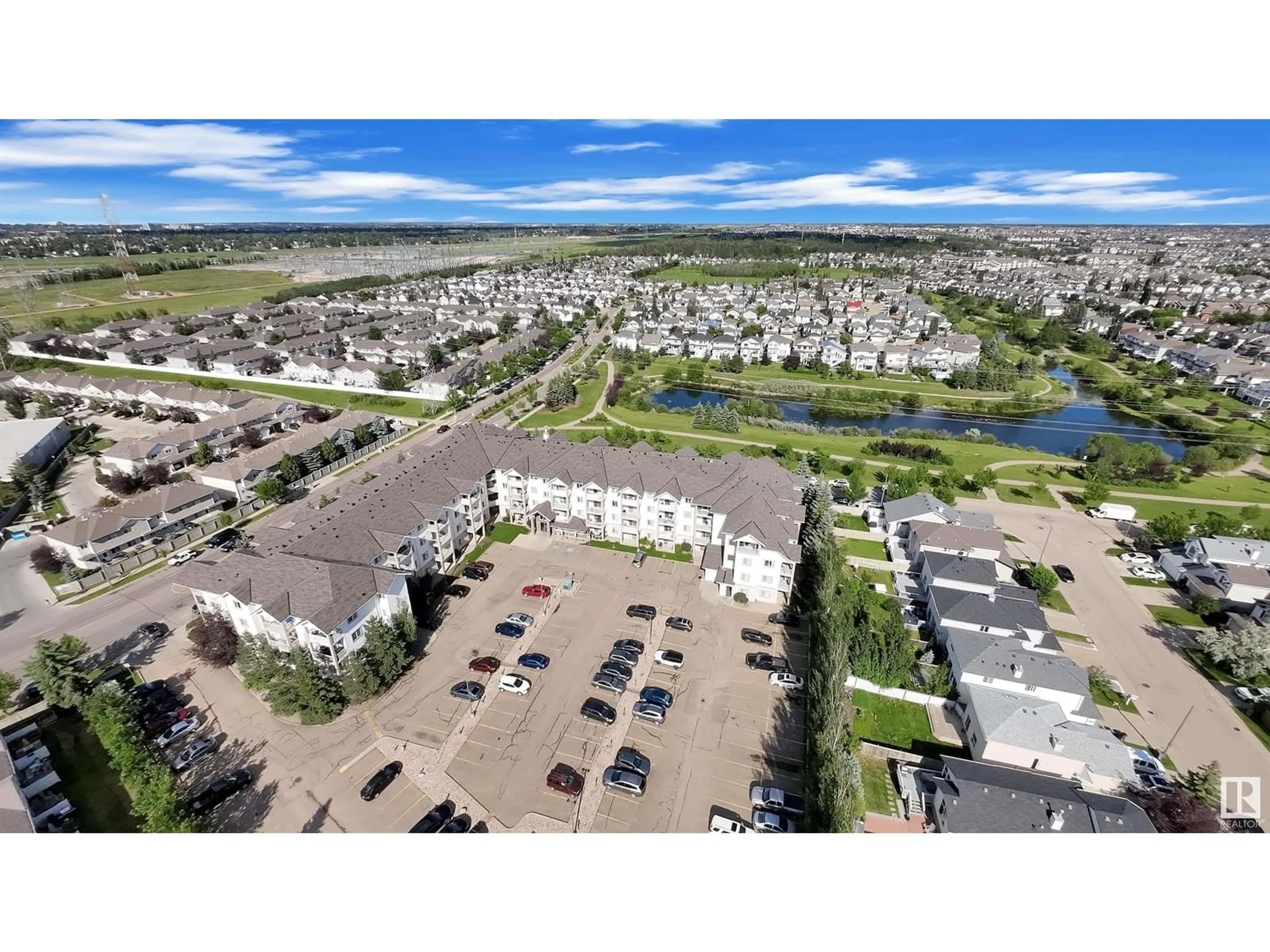 A pic from outside/outdoor area/front of a property/back of a property/a pic from drone, water/lake/river/ocean view for 122 245 EDWARDS DR, Edmonton Alberta T6X1J9