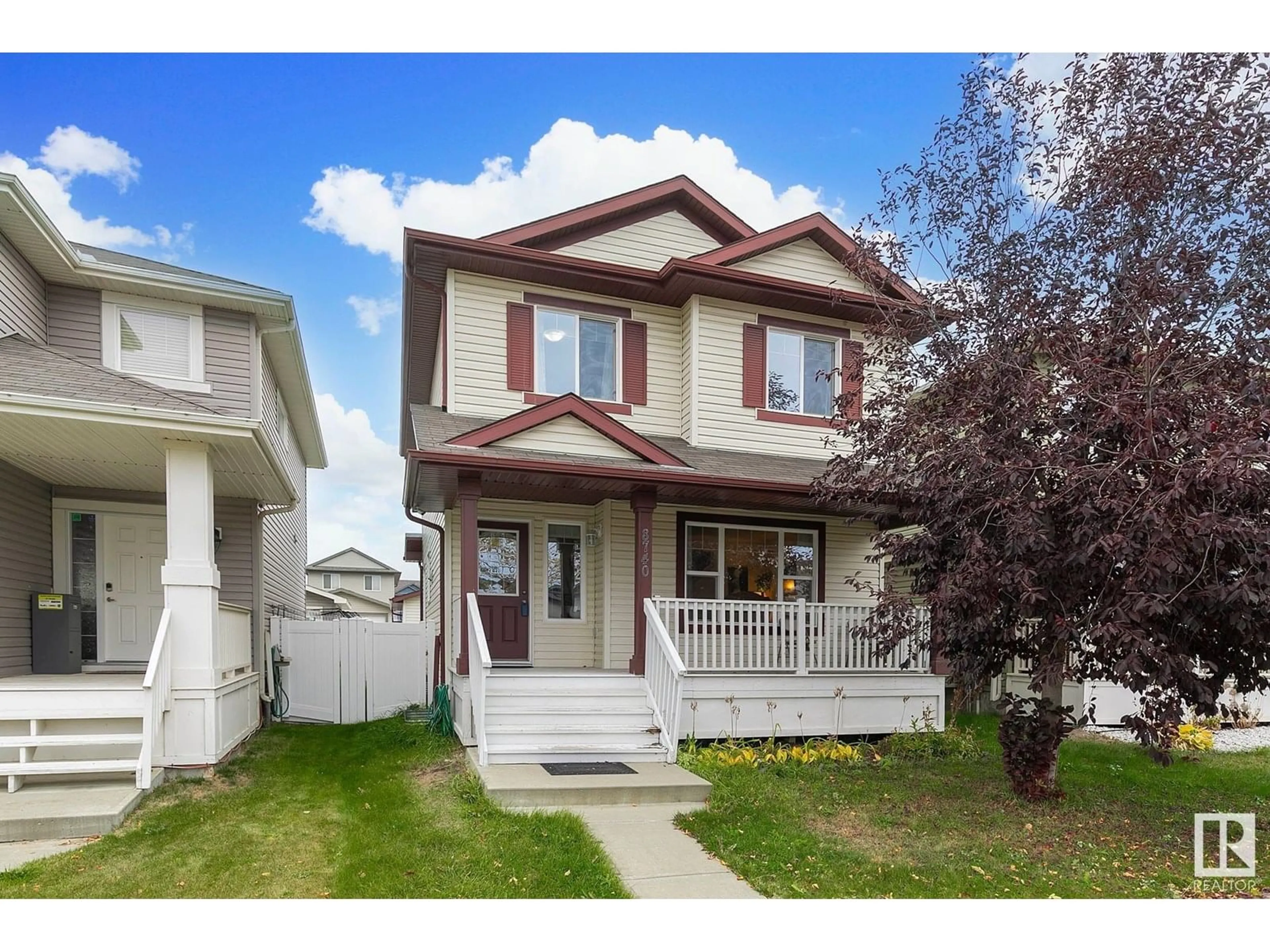 Home with vinyl exterior material, street for 8740 180 AV, Edmonton Alberta T5X0E3