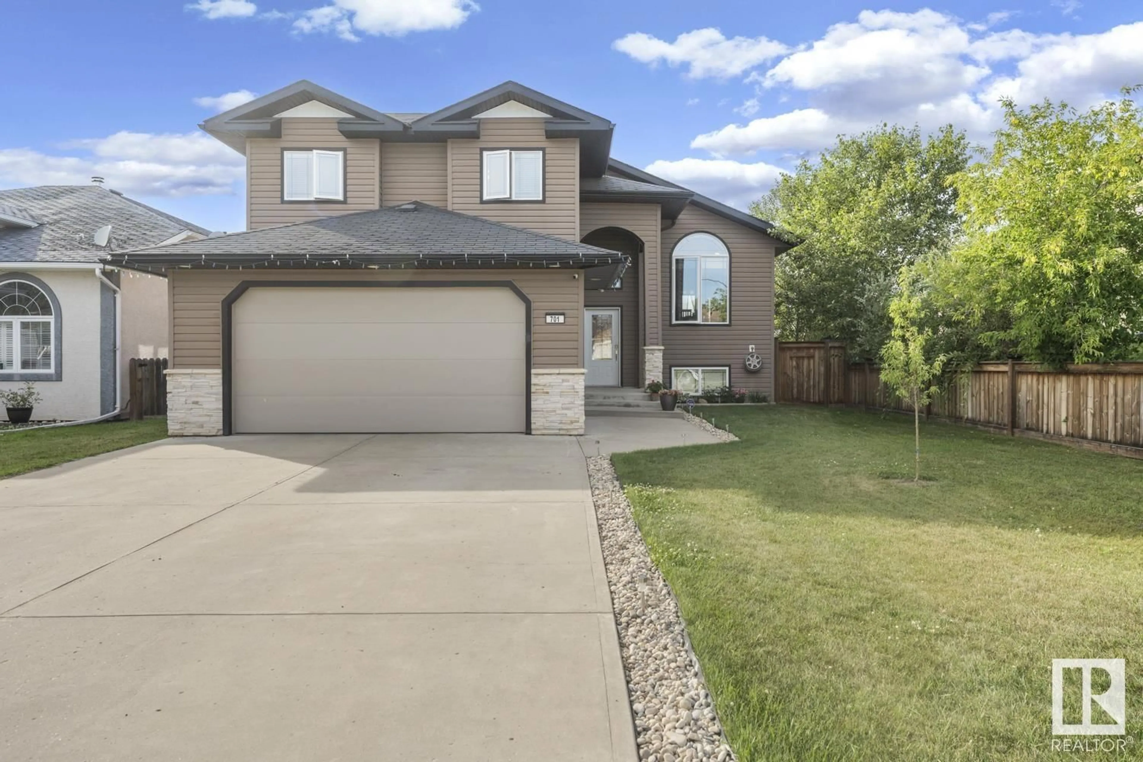 Home with vinyl exterior material, street for 701 21 STREET, Cold Lake Alberta T9M1M8