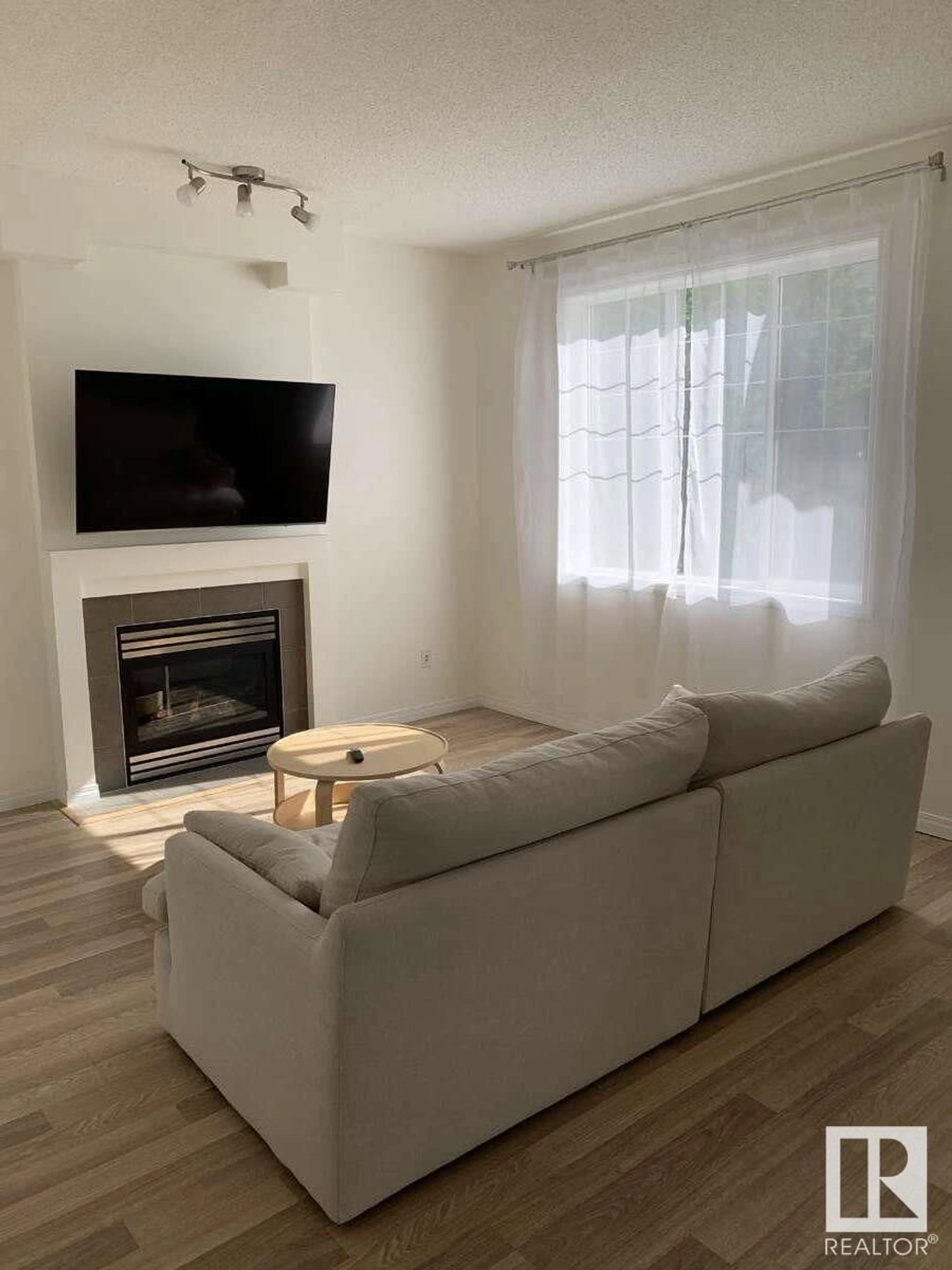 Living room with furniture, wood/laminate floor for #33 - 4821 TERWILLEGAR CM, Edmonton Alberta T6R0C5