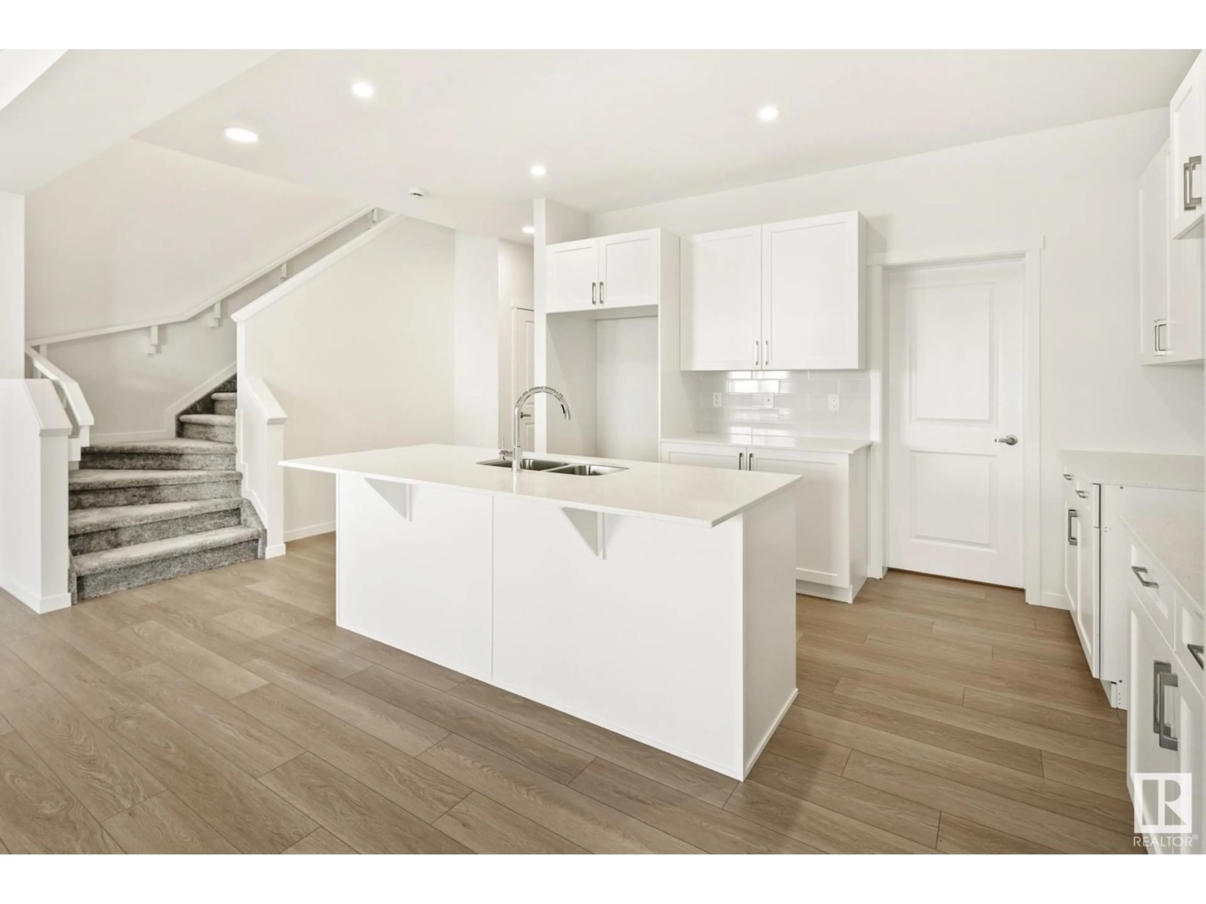 Open concept kitchen, wood/laminate floor for 6314 KING WD, Edmonton Alberta T6W5G4