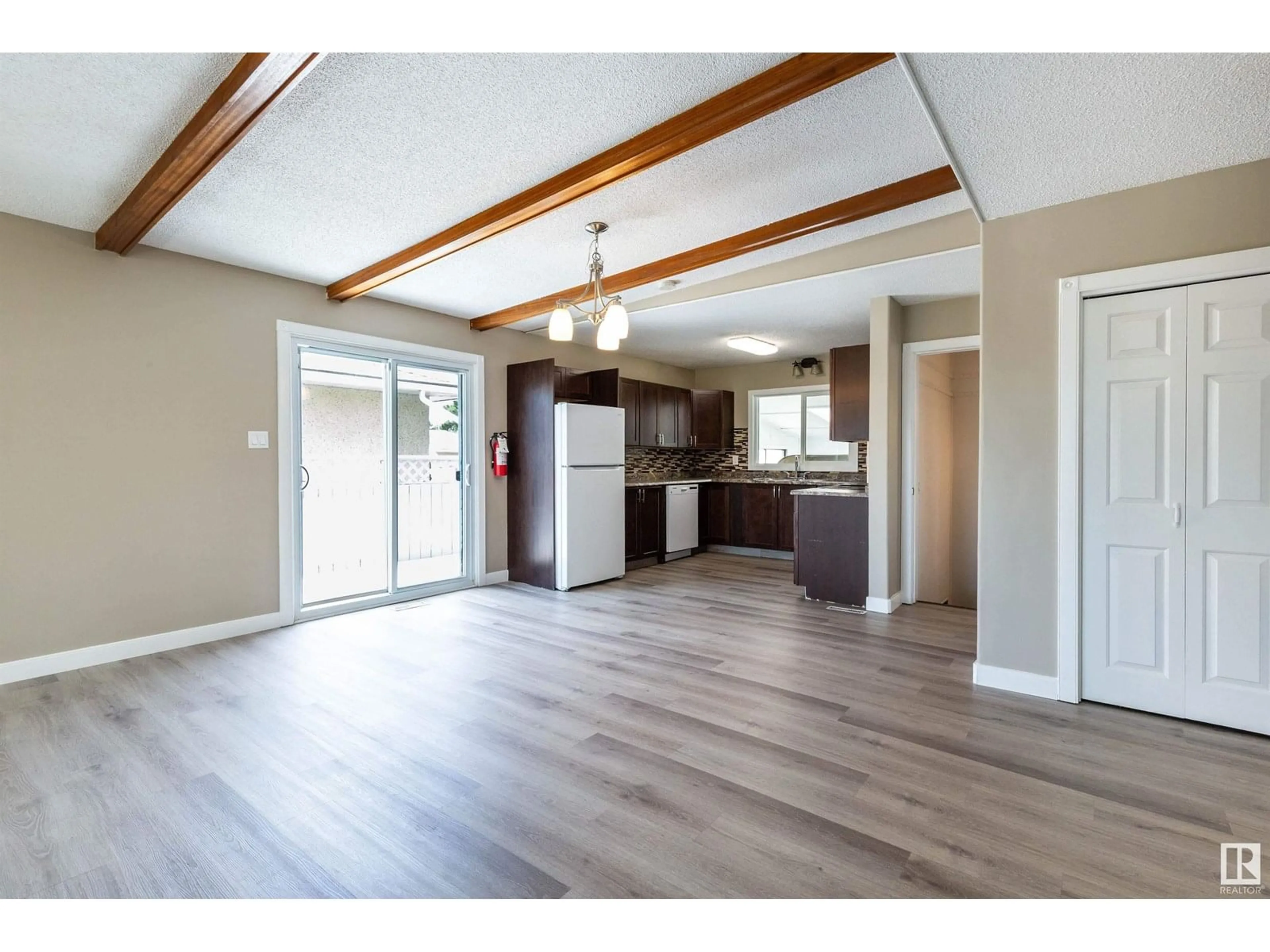 Open concept kitchen, wood/laminate floor for 7208 137 AV, Edmonton Alberta T5C2L5