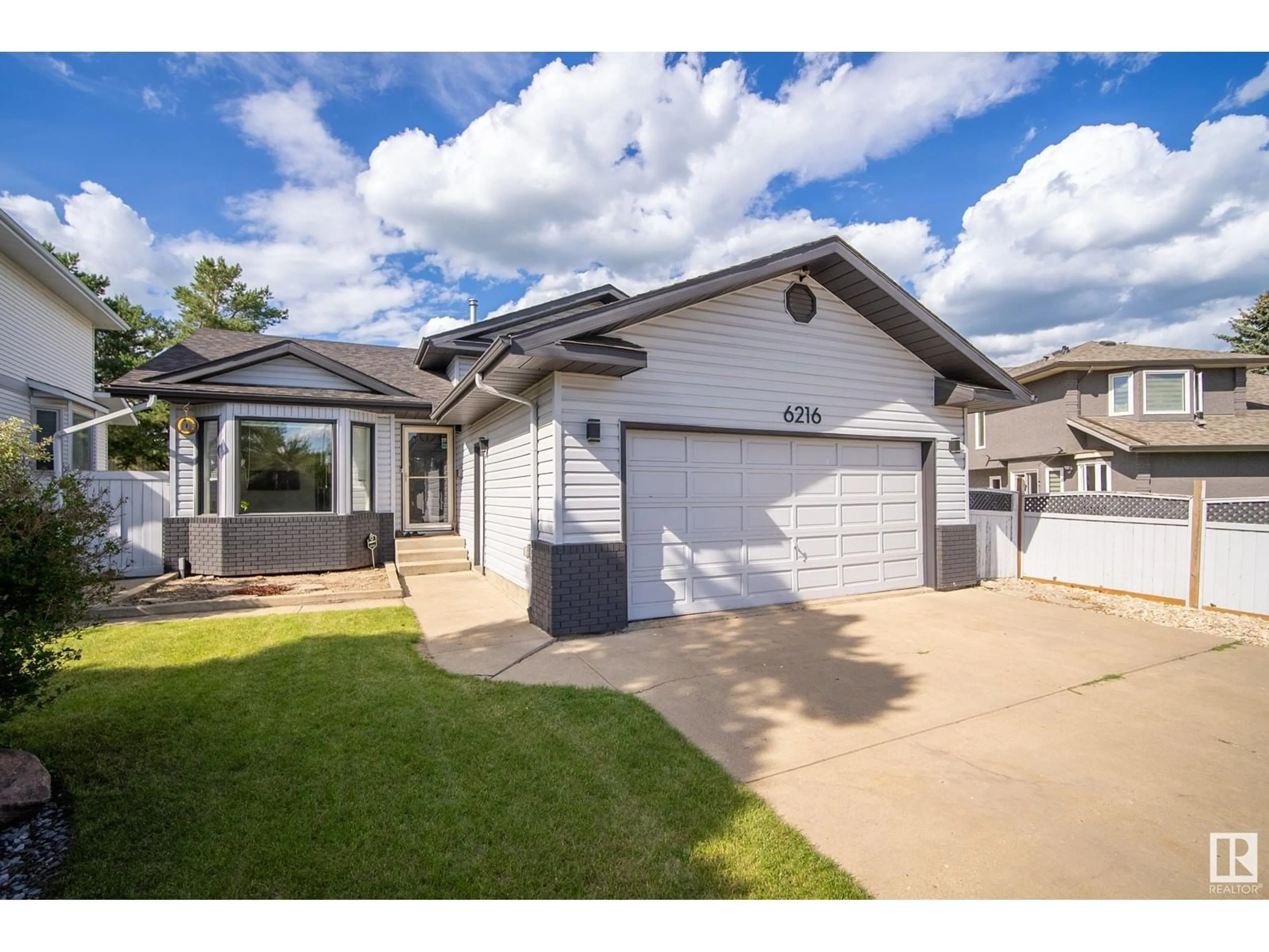 Home with vinyl exterior material, street for NW - 6216 152C AV, Edmonton Alberta T5A4V7