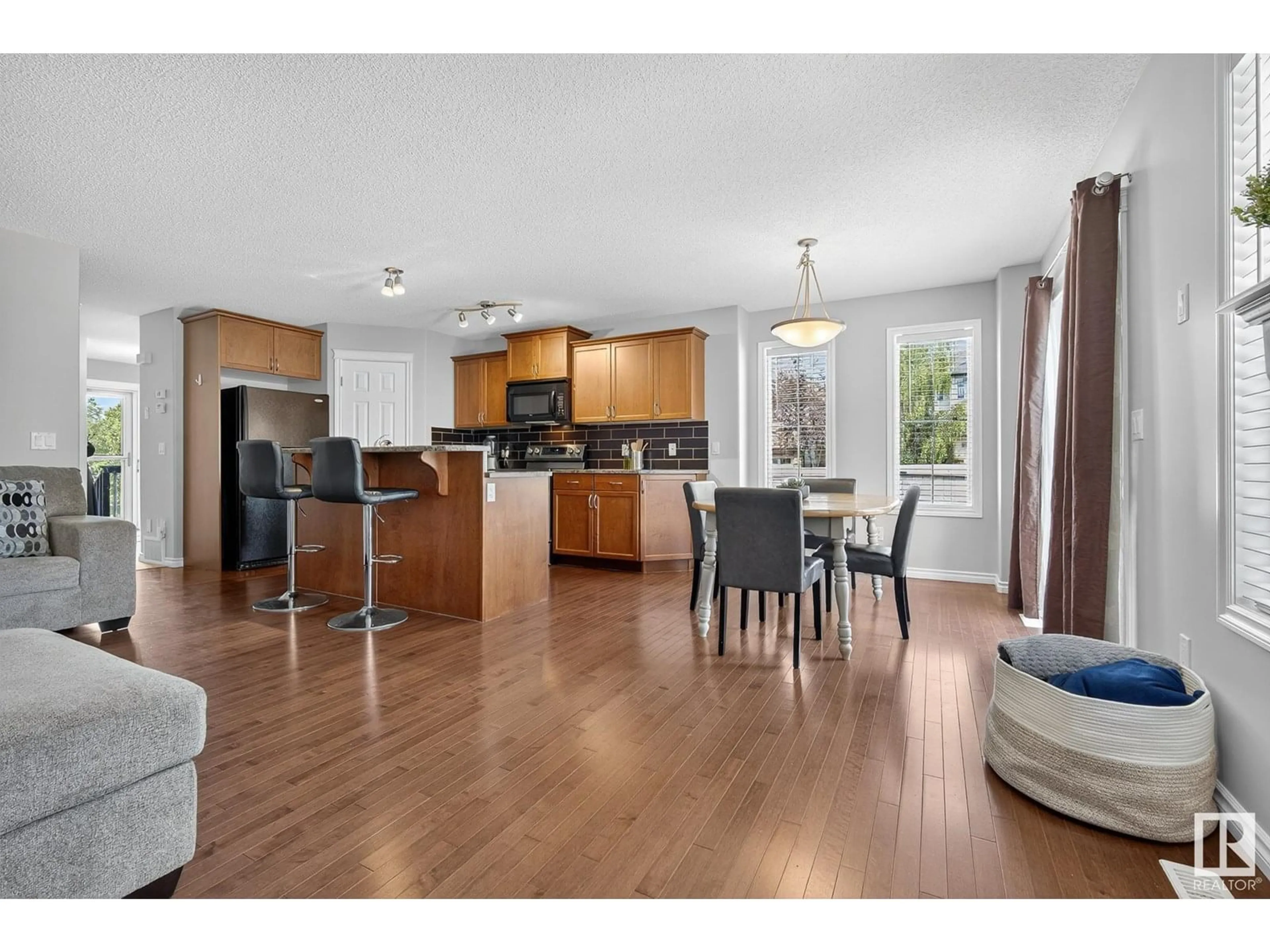 Open concept kitchen, wood/laminate floor for SW - 1609 65 ST, Edmonton Alberta T6X0N1