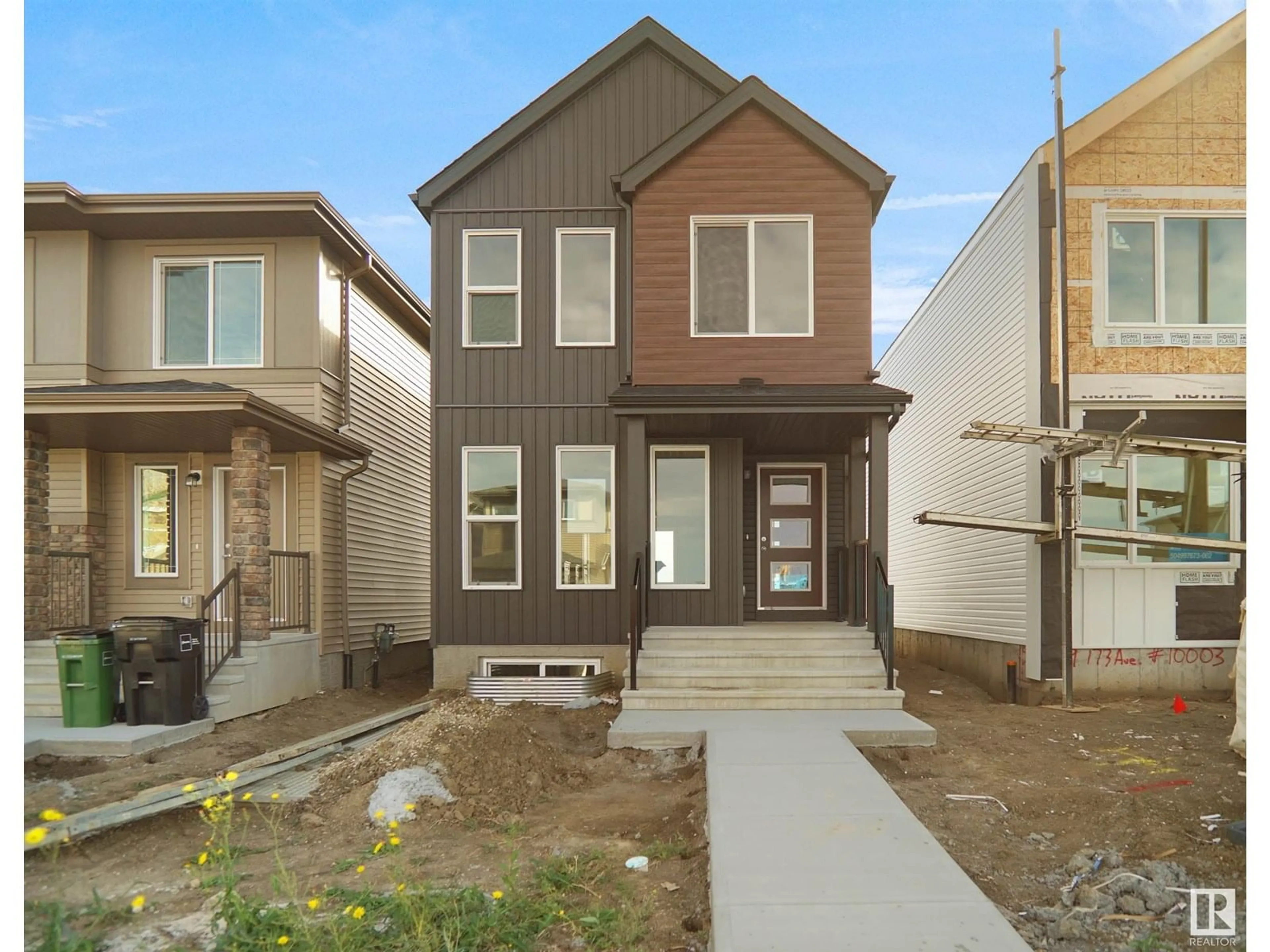 Home with brick exterior material, street for NW - 21035 25 AV, Edmonton Alberta T5Y4G2