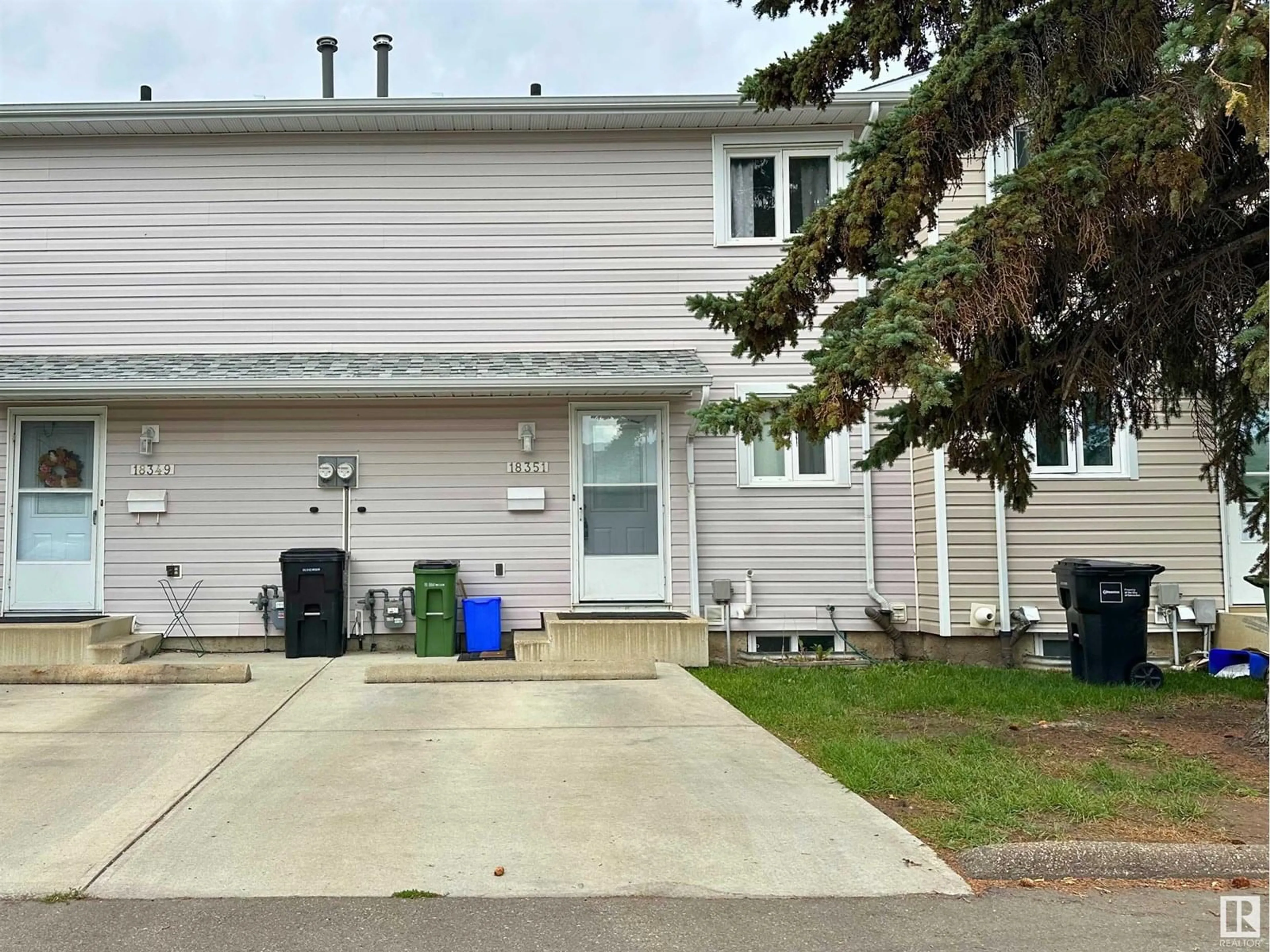 Home with vinyl exterior material, street for 18351 66 AV, Edmonton Alberta T5T1Z5