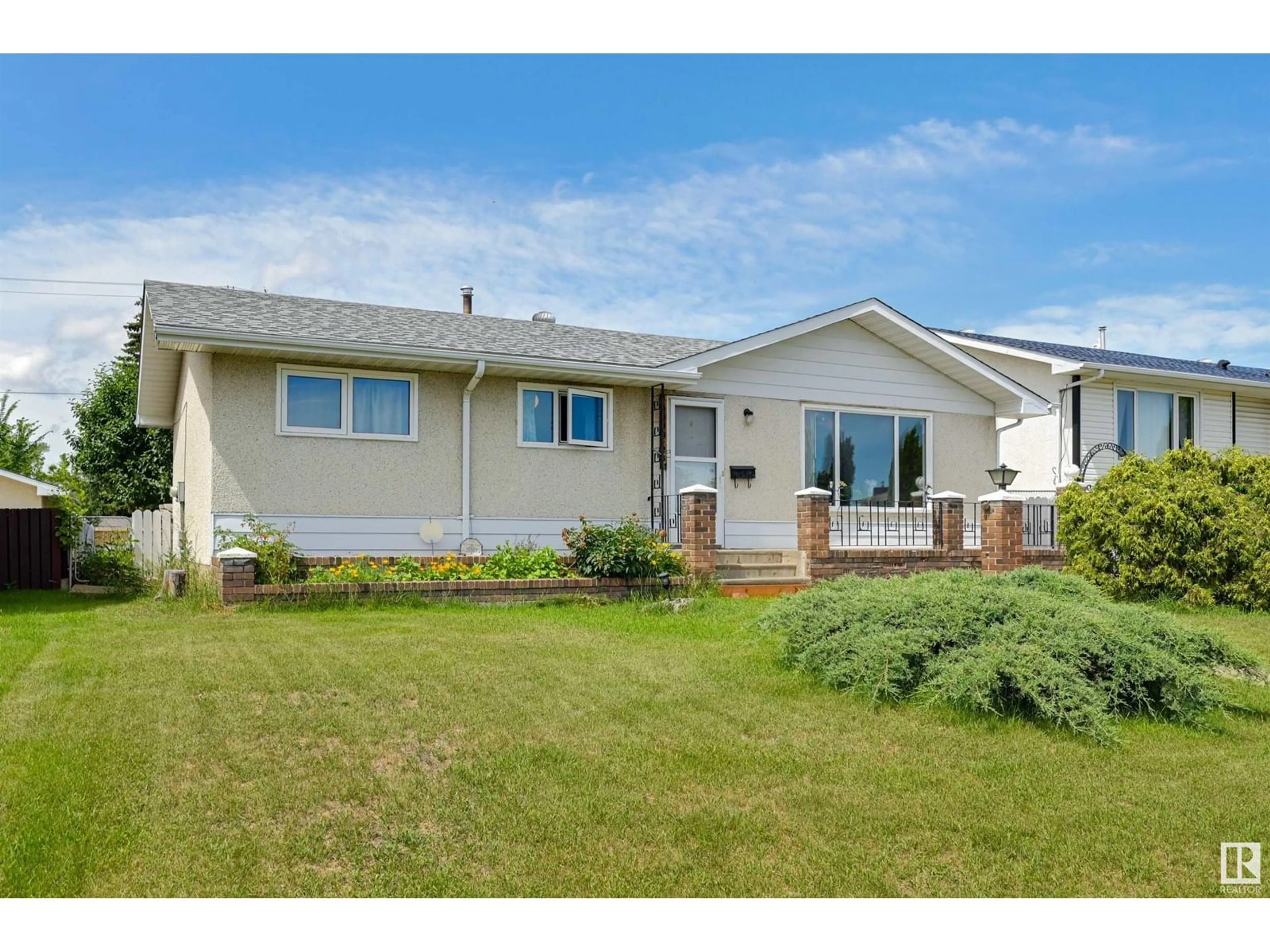 Home with vinyl exterior material, street for NW - 15008 96 ST, Edmonton Alberta T5E4W7