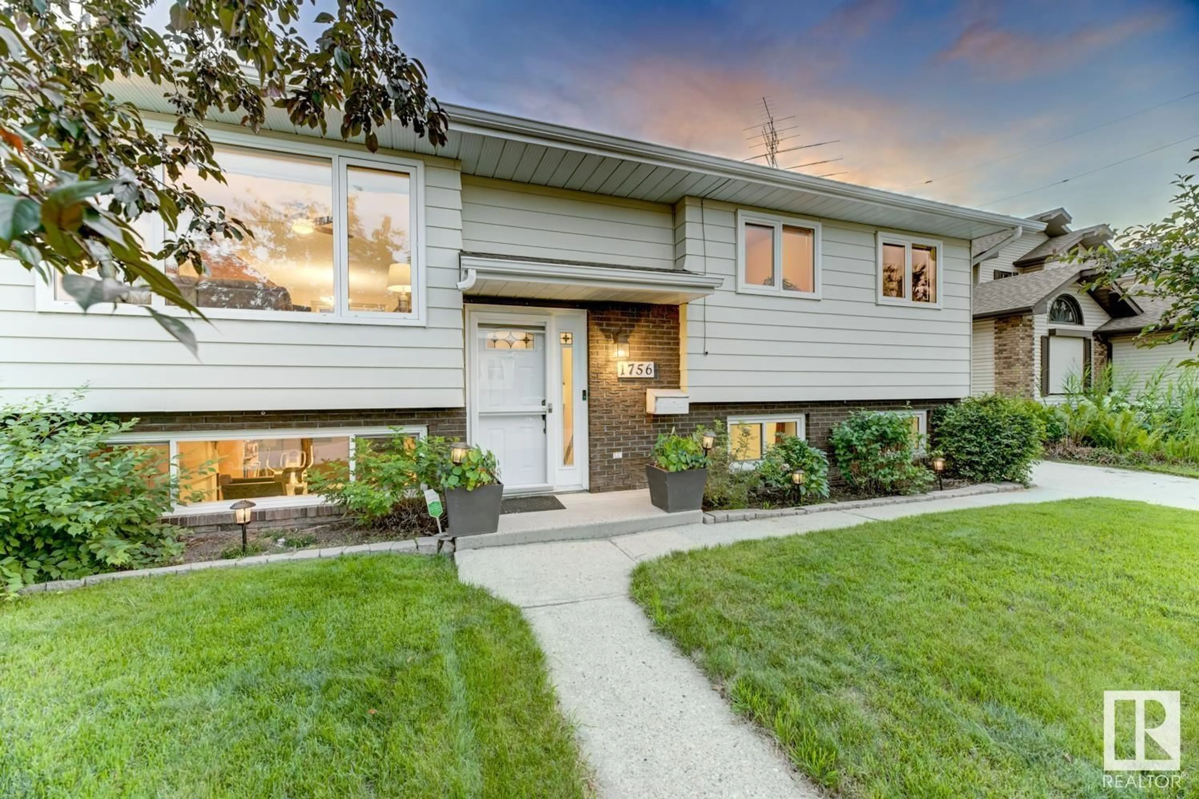 Home with vinyl exterior material, street for 1756 49A ST, Edmonton Alberta T6L3K6