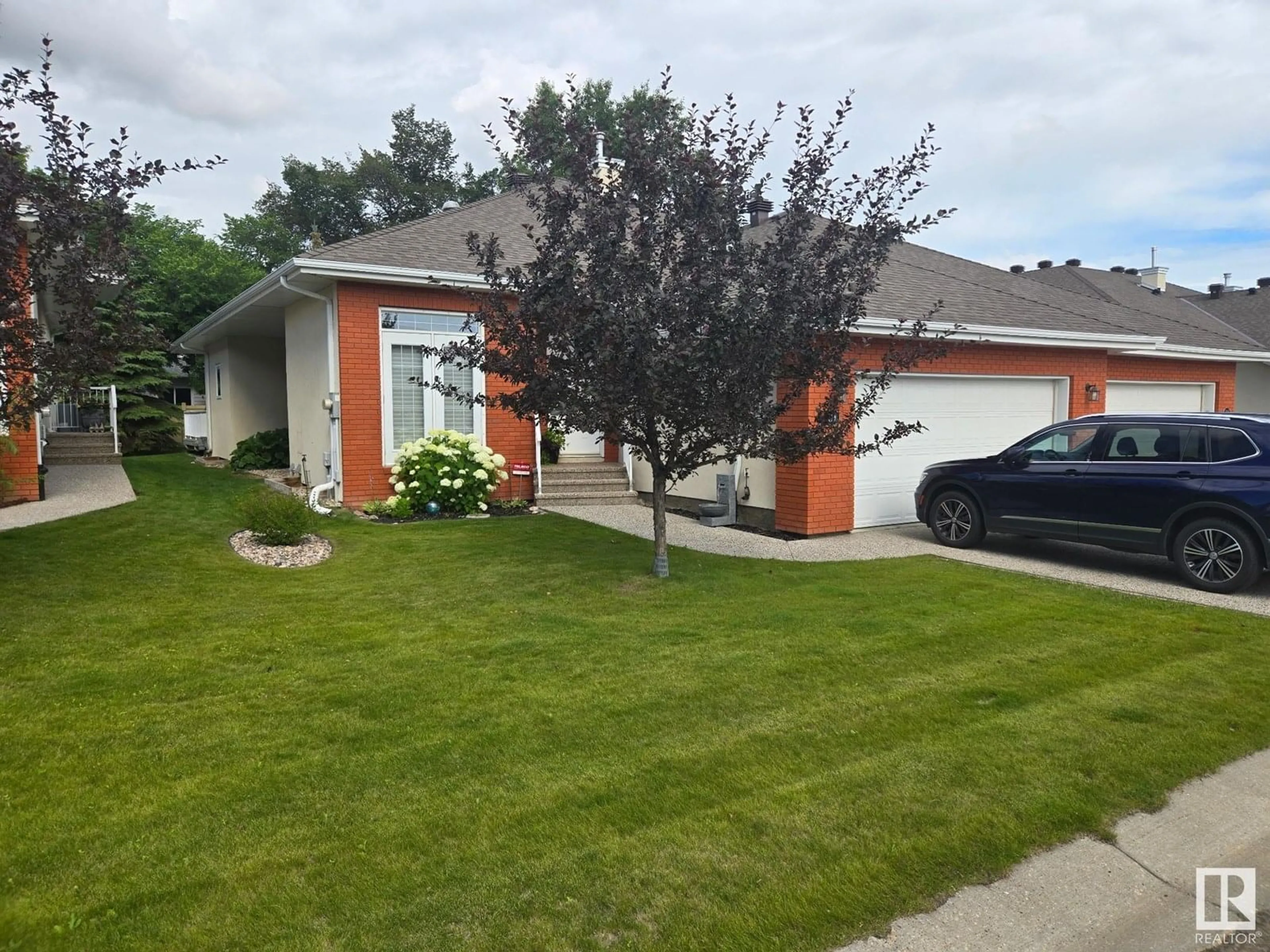 A pic from outside/outdoor area/front of a property/back of a property/a pic from drone, street for #31 - 1225 WANYANDI RD, Edmonton Alberta T6M2W7