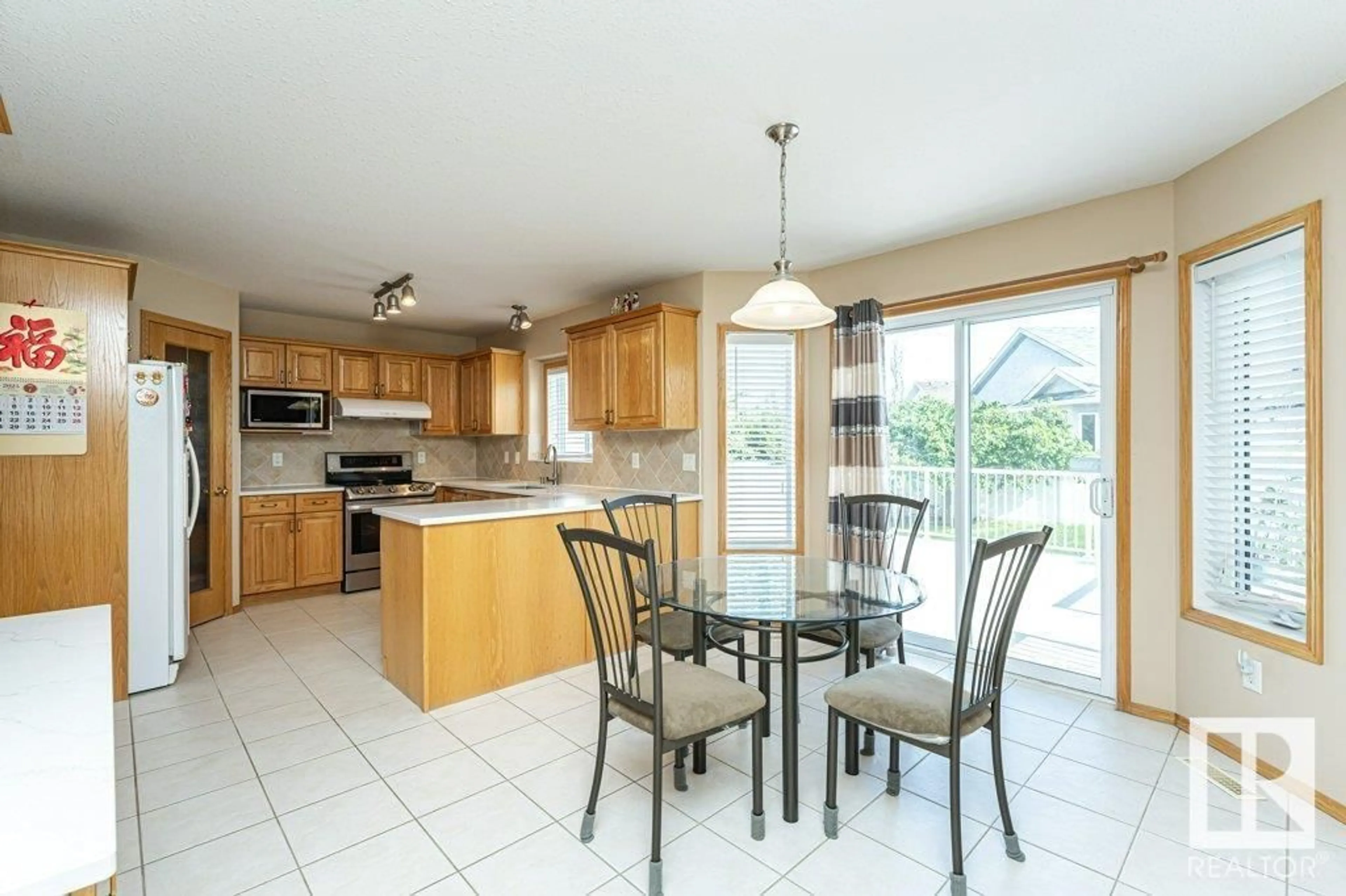Open concept kitchen, ceramic/tile floor for 7220 161 AV, Edmonton Alberta T5Z3T1