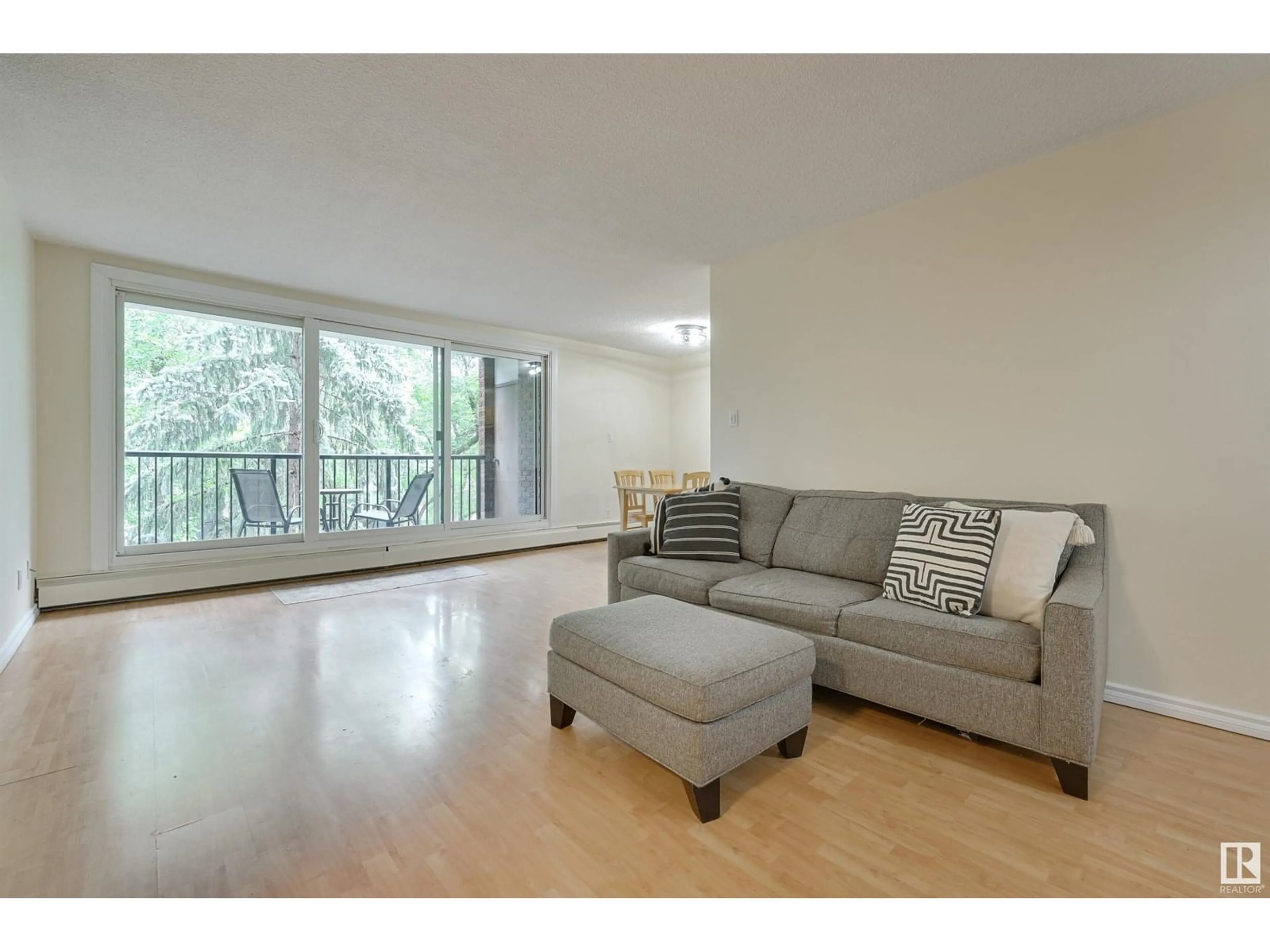Living room with furniture, wood/laminate floor for 407 - 11011 86 AV, Edmonton Alberta T6G0X1
