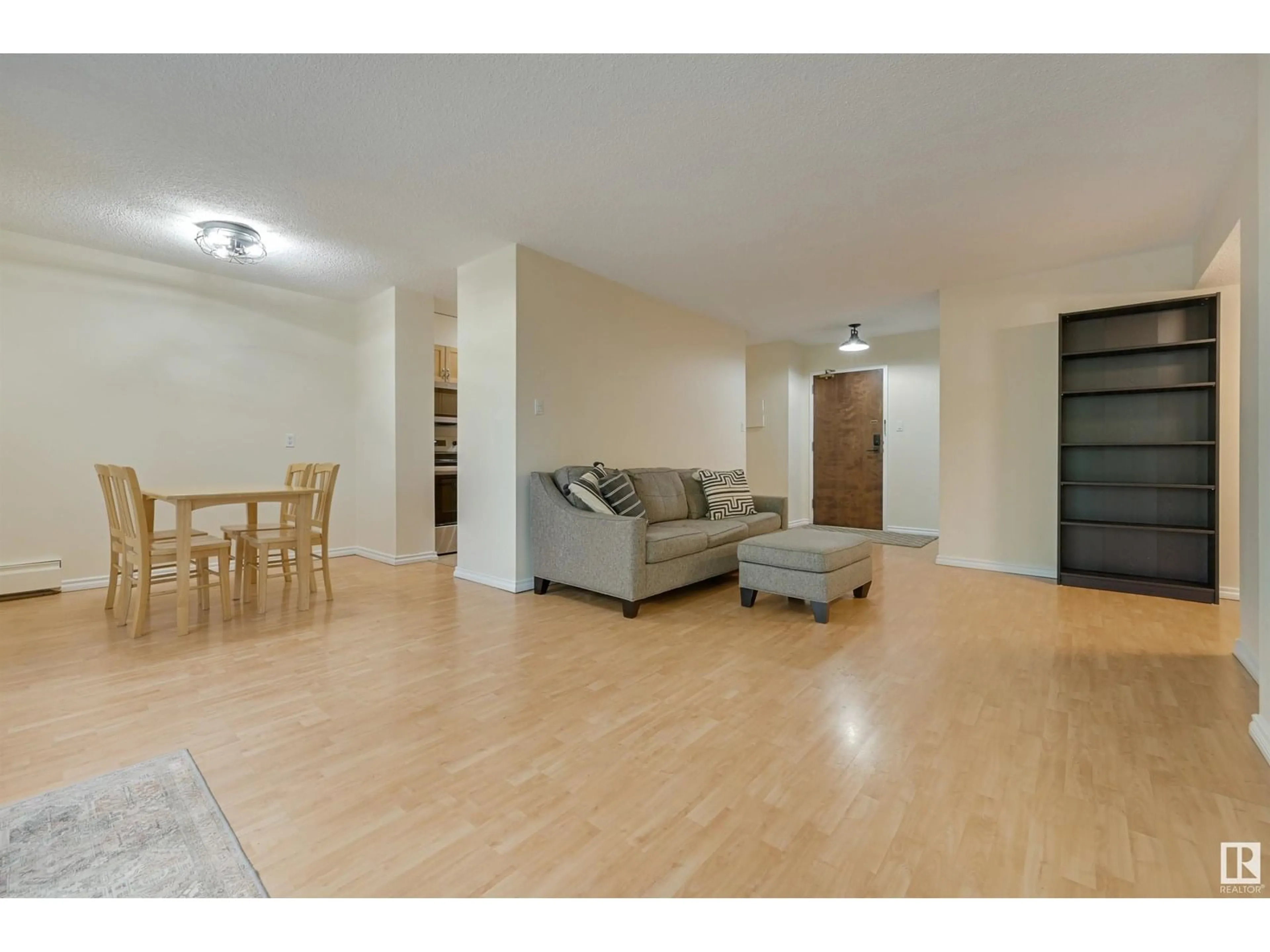 Living room with furniture, wood/laminate floor for 407 - 11011 86 AV, Edmonton Alberta T6G0X1