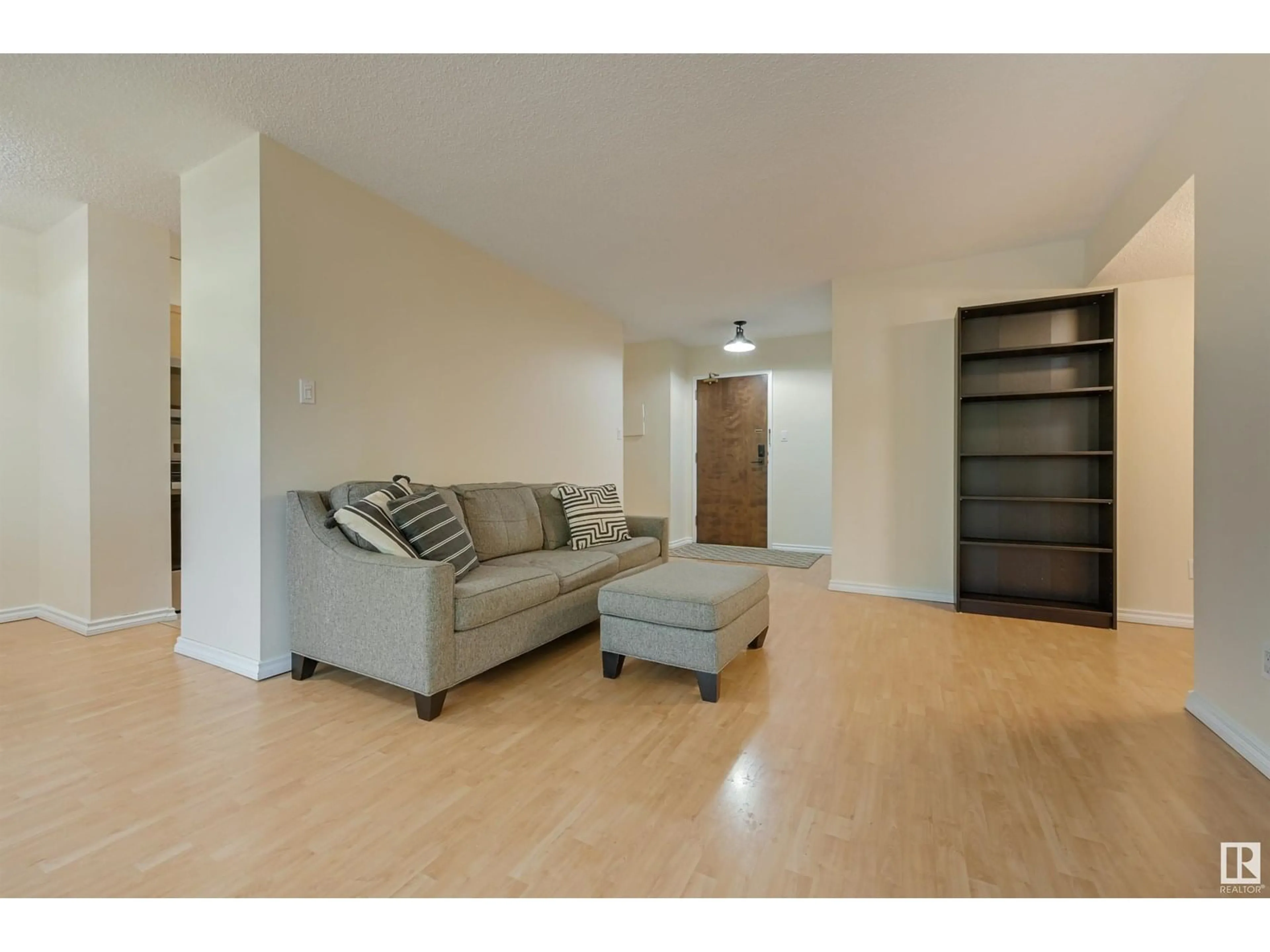 Living room with furniture, wood/laminate floor for 407 - 11011 86 AV, Edmonton Alberta T6G0X1