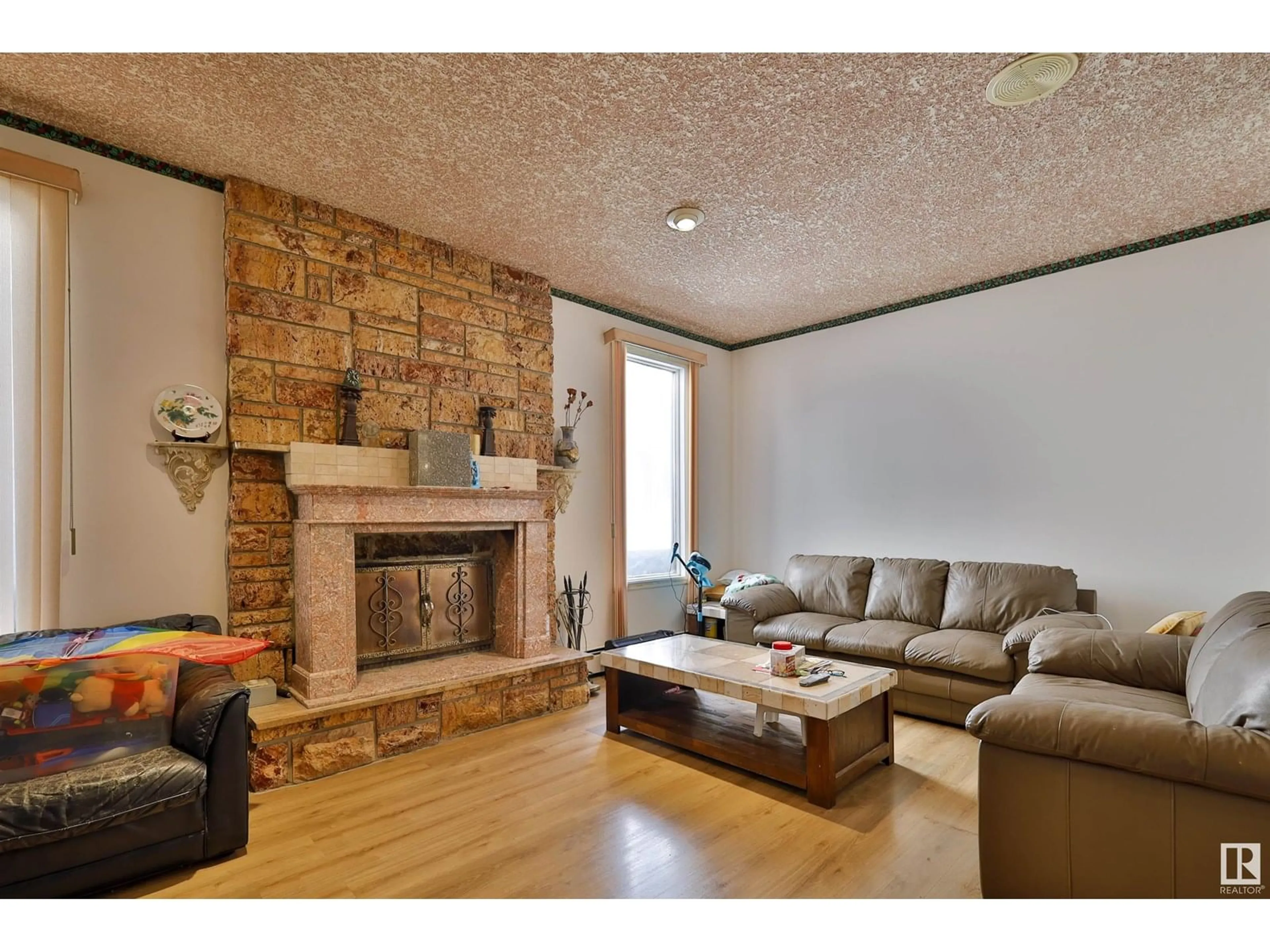 Living room with furniture, wood/laminate floor for NW - 15808 100 ST, Edmonton Alberta T5X4E4