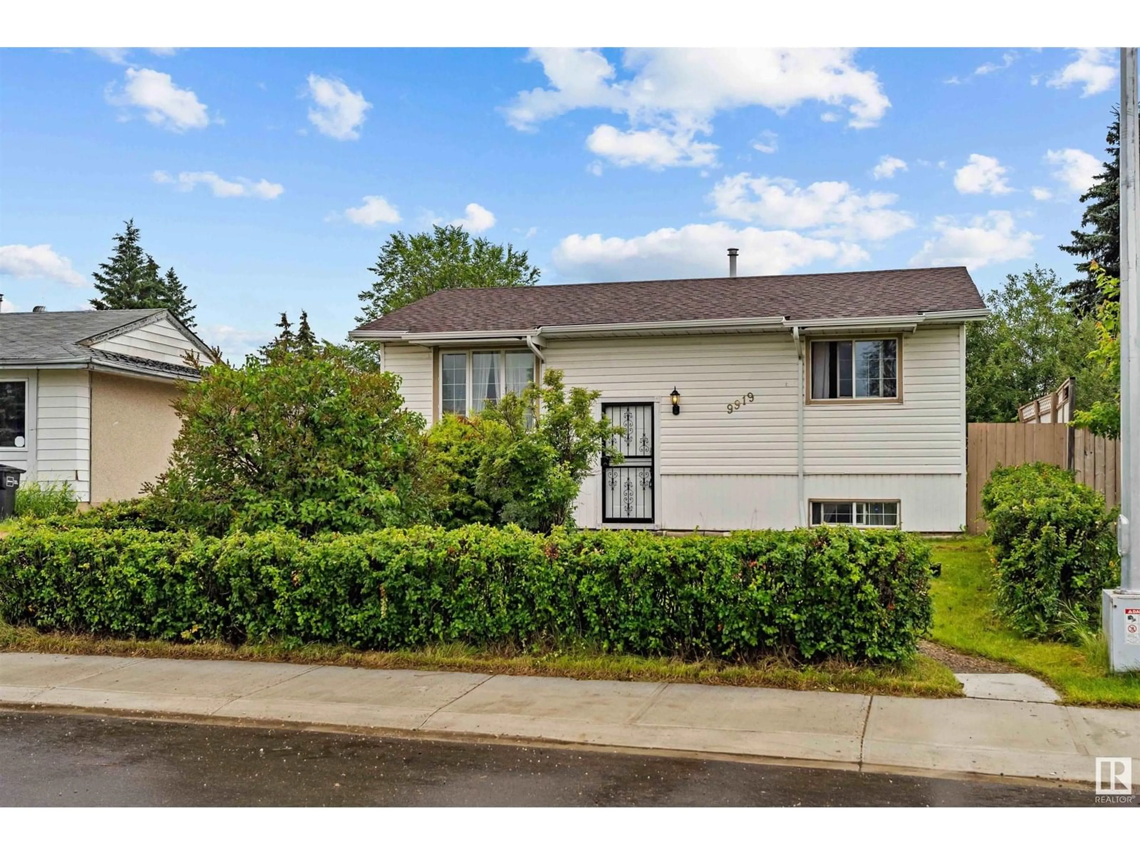 Home with vinyl exterior material, street for 9919 170 AV, Edmonton Alberta T5X3G3