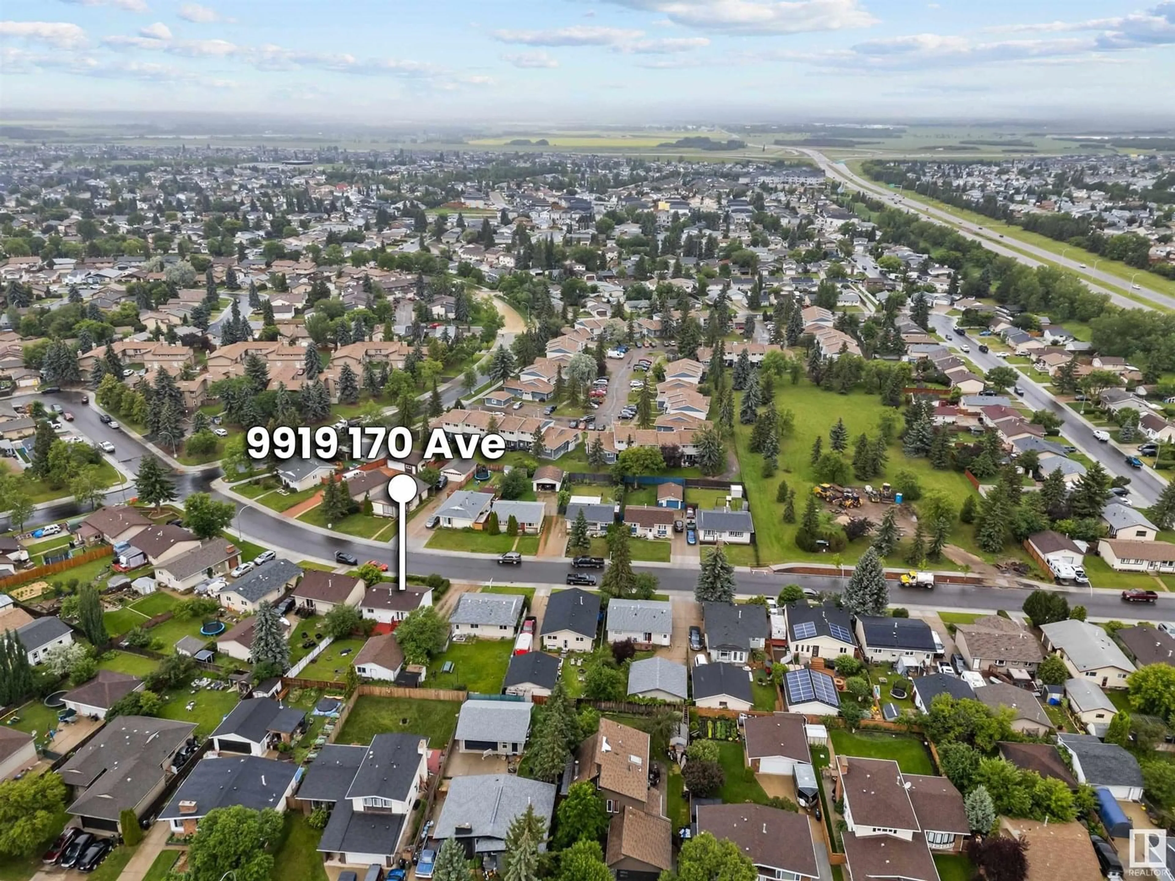 A pic from outside/outdoor area/front of a property/back of a property/a pic from drone, street for 9919 170 AV, Edmonton Alberta T5X3G3