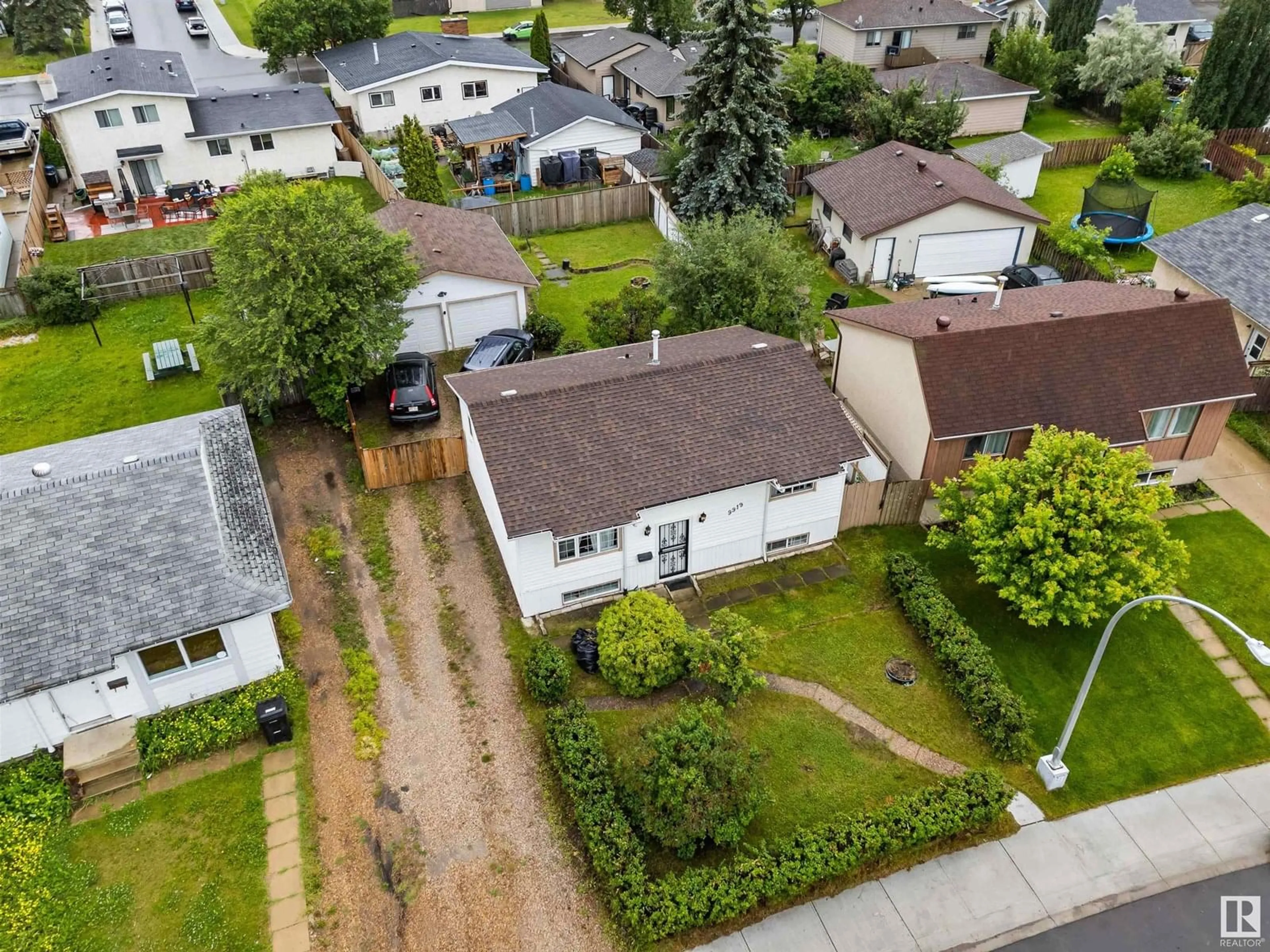 A pic from outside/outdoor area/front of a property/back of a property/a pic from drone, street for 9919 170 AV, Edmonton Alberta T5X3G3