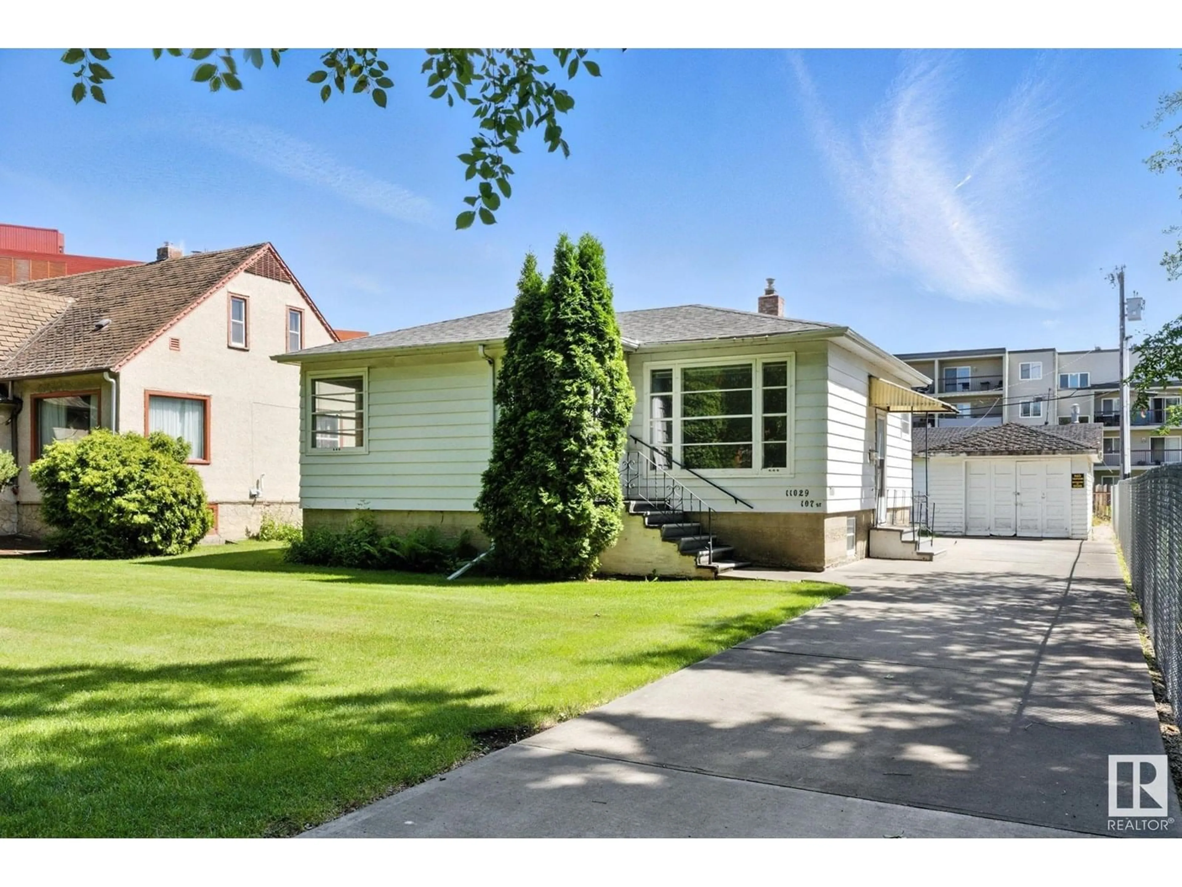 Home with vinyl exterior material, street for NW - 11029 107 ST, Edmonton Alberta T5H2Z6