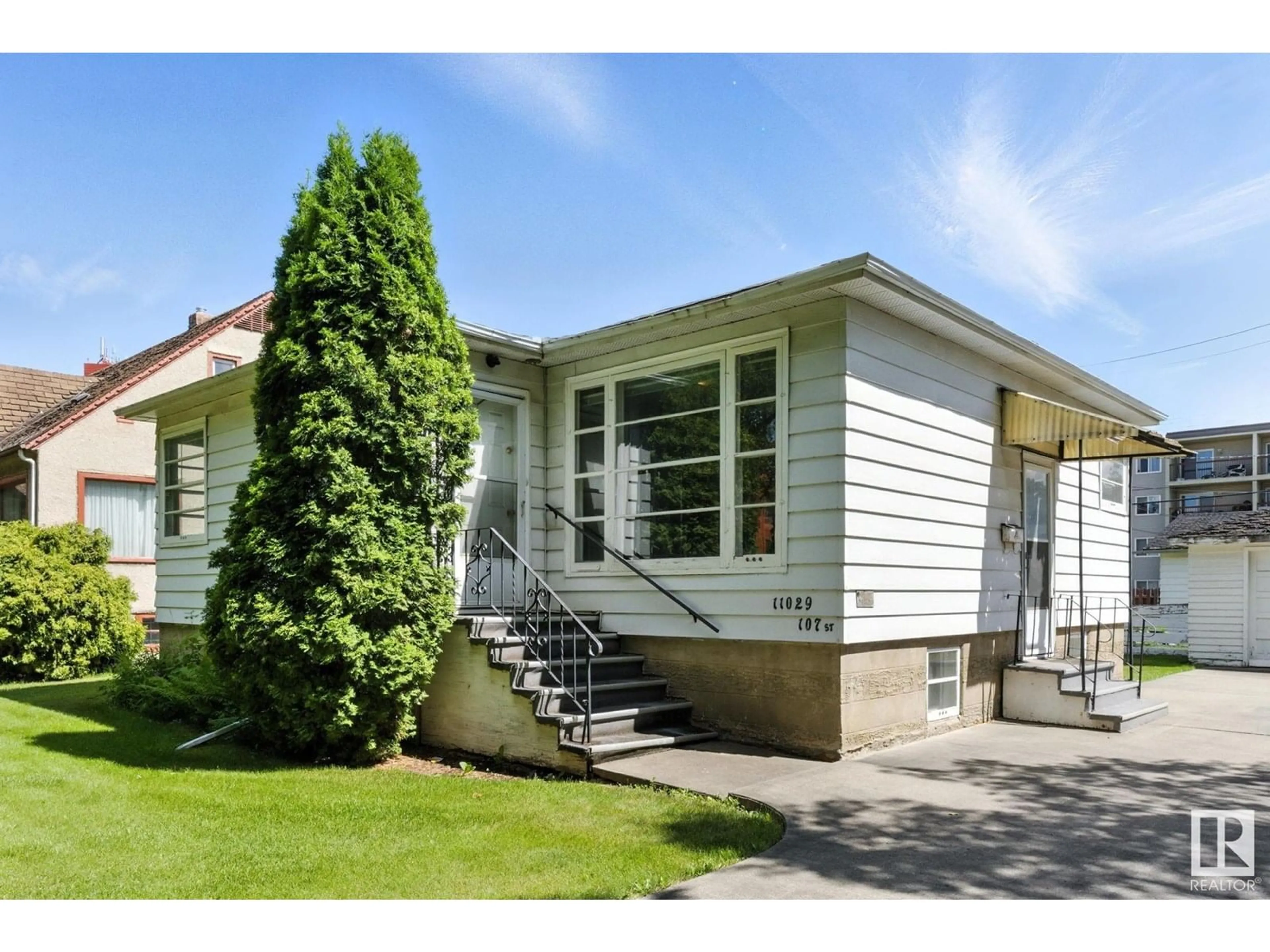 Home with vinyl exterior material, street for NW - 11029 107 ST, Edmonton Alberta T5H2Z6