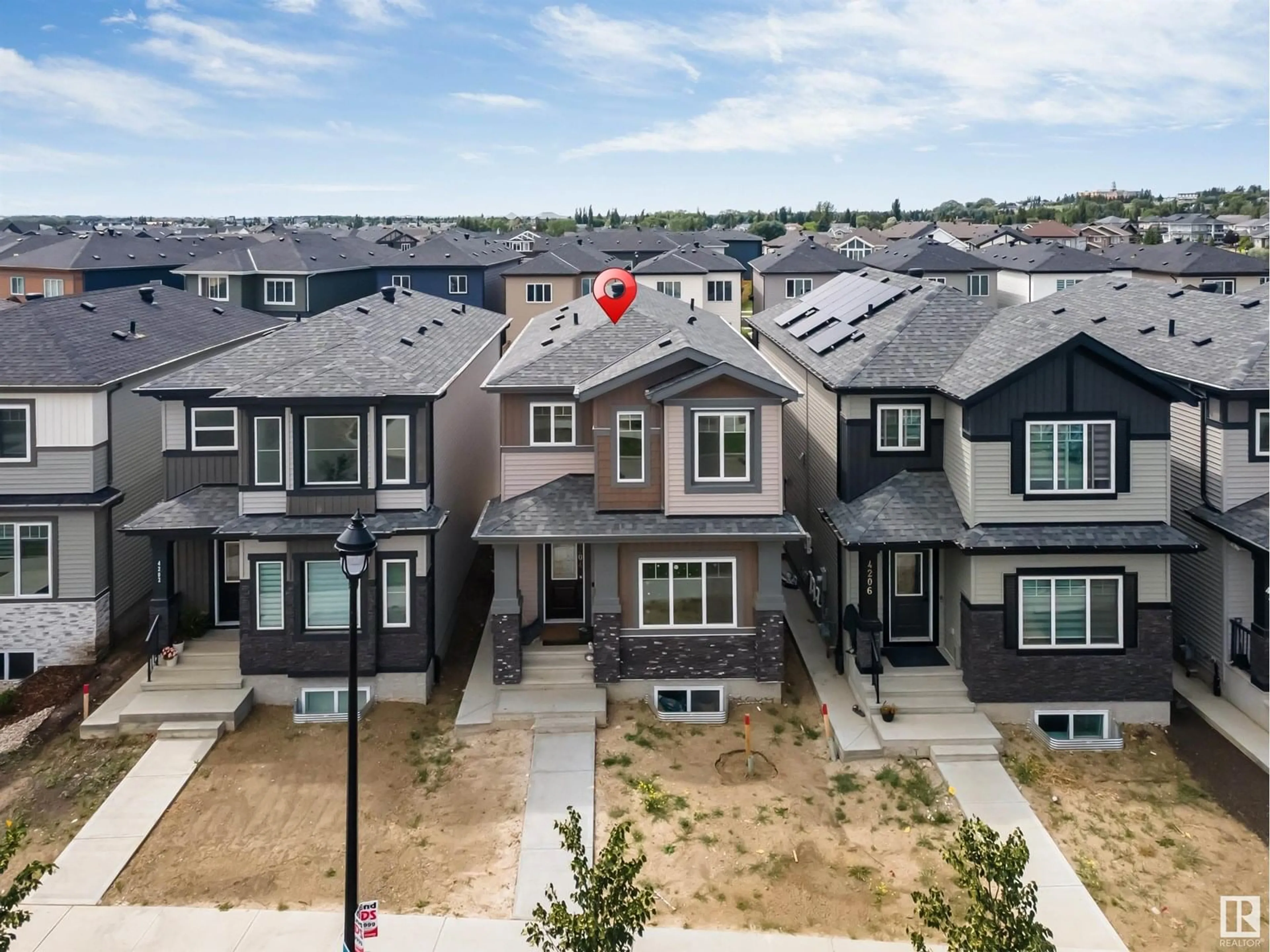 A pic from outside/outdoor area/front of a property/back of a property/a pic from drone, street for 4204 38 ST, Beaumont Alberta T4X0C4