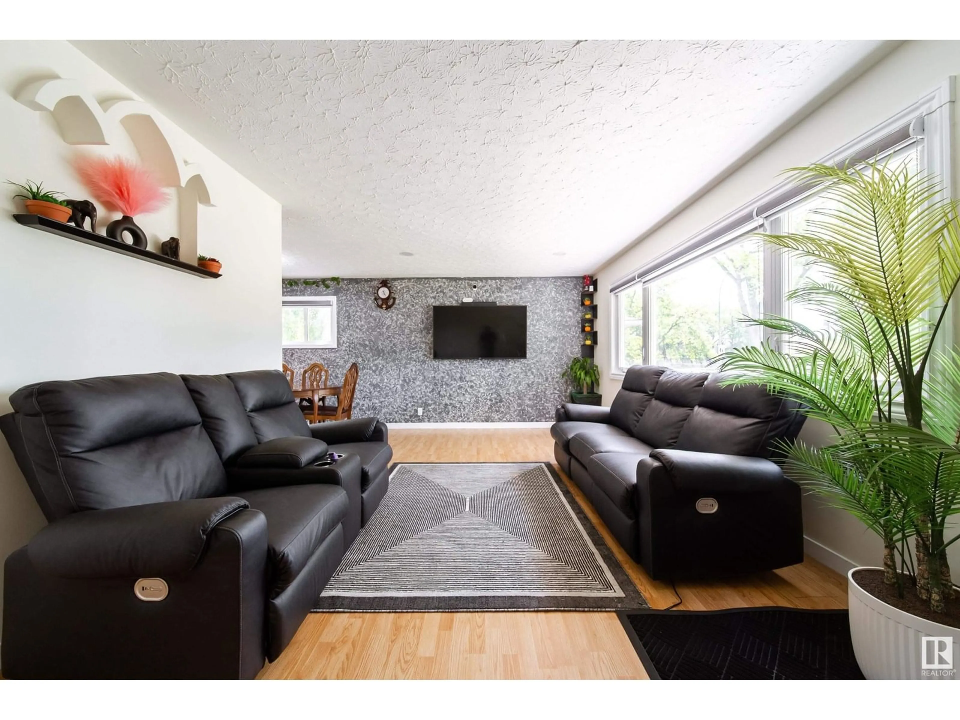 Living room with furniture, wood/laminate floor for 15906 92 AV, Edmonton Alberta T5R5C6