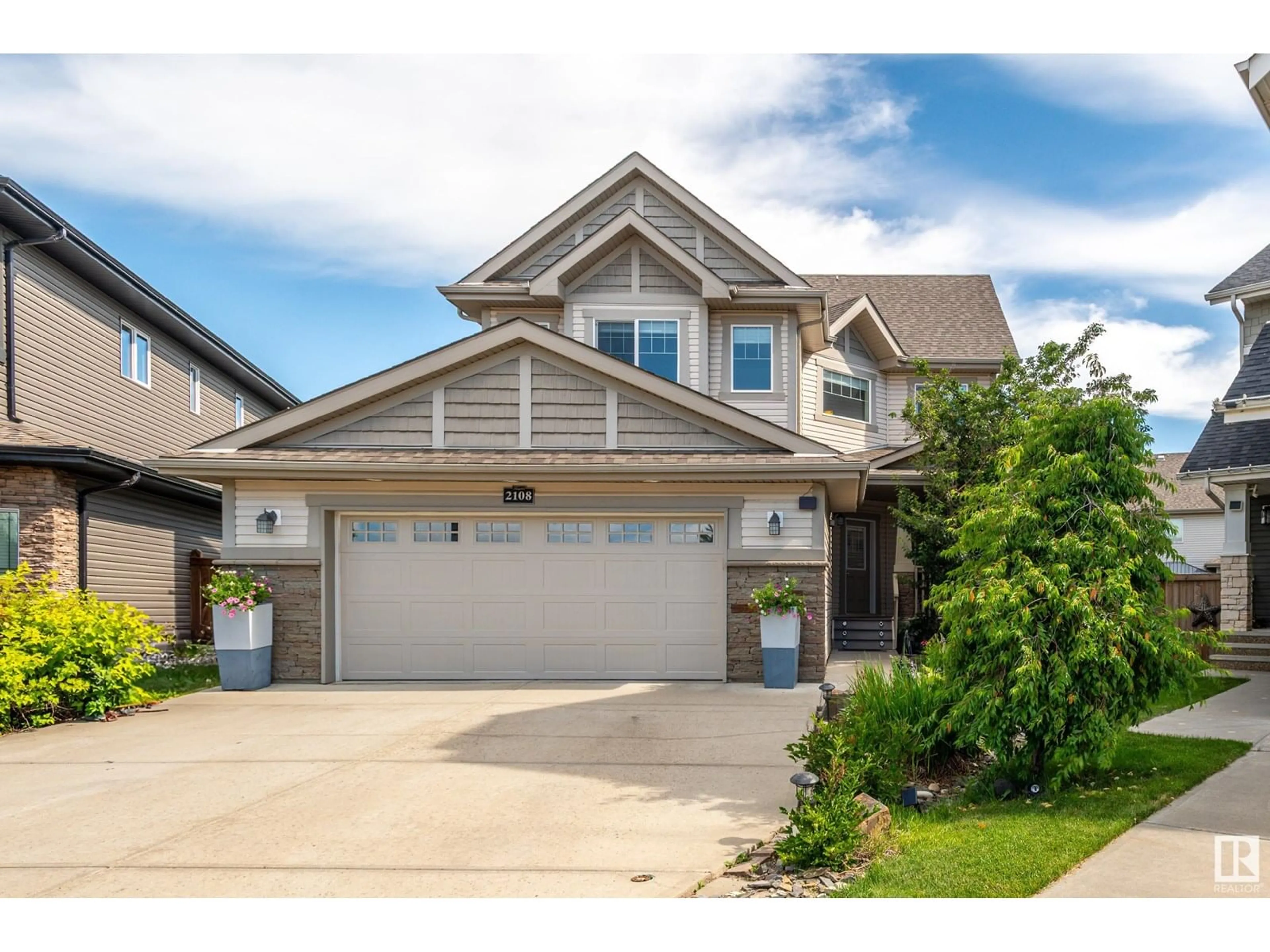 Home with brick exterior material, street for 2108 TRUMPETER WY, Edmonton Alberta T5S0G1