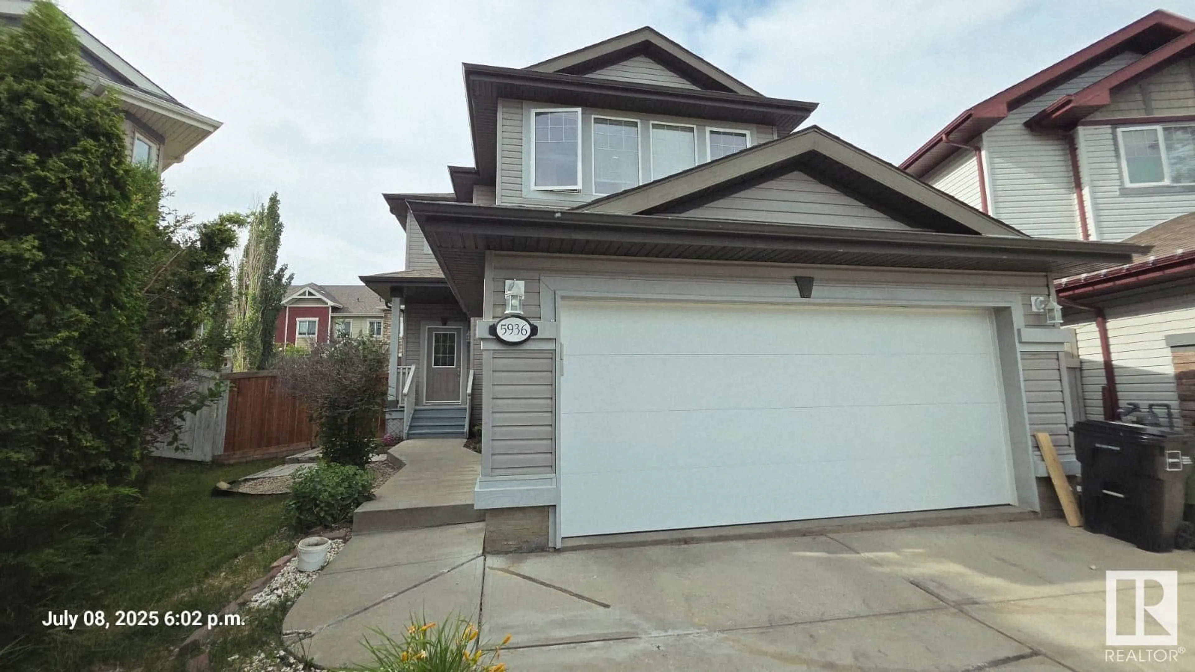 Home with vinyl exterior material, street for NW - 5936 209 ST, Edmonton Alberta T6M0L1