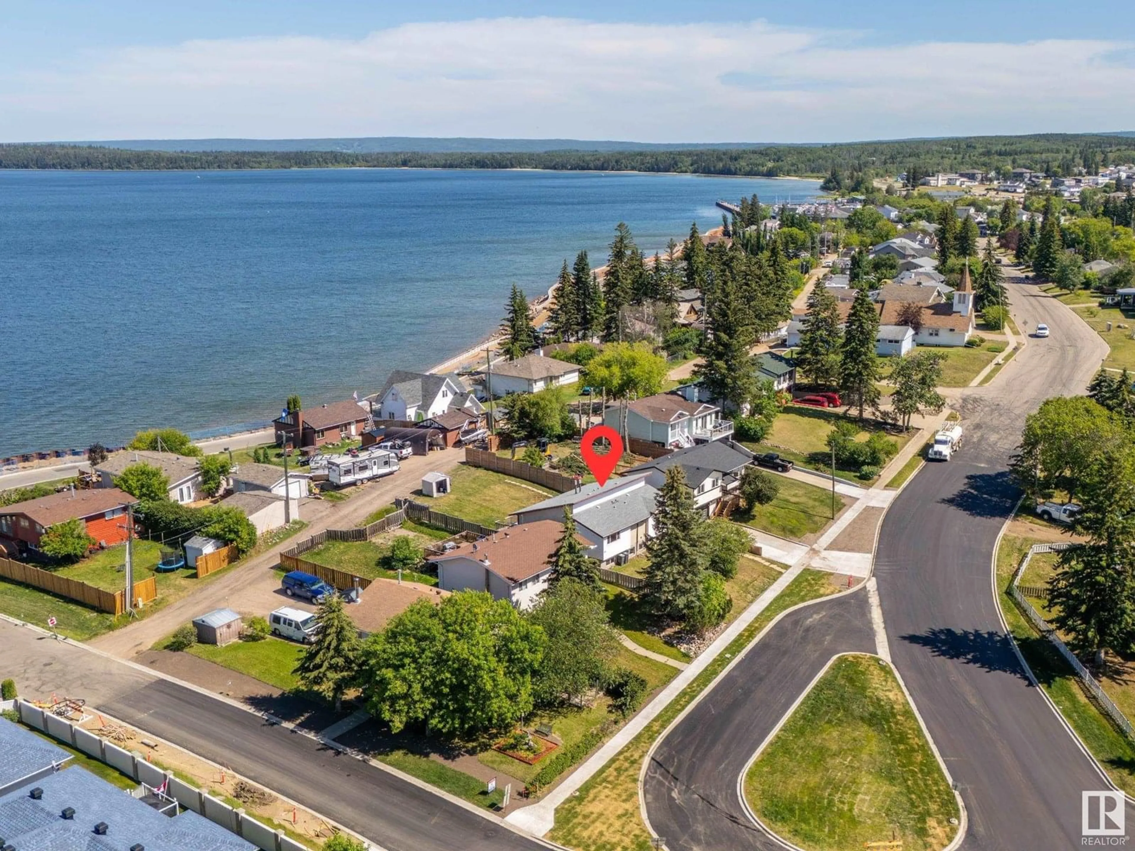 A pic from outside/outdoor area/front of a property/back of a property/a pic from drone, water/lake/river/ocean view for 206 10 ST, Cold Lake Alberta T9M1A5