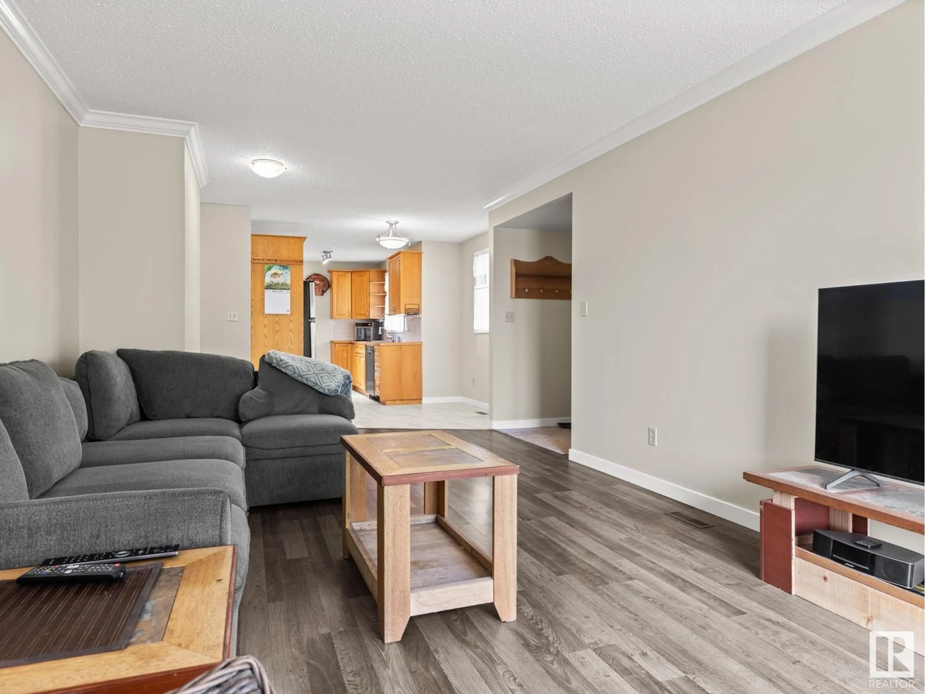 Living room with furniture, wood/laminate floor for 17219 106 ST, Edmonton Alberta T6X3G9