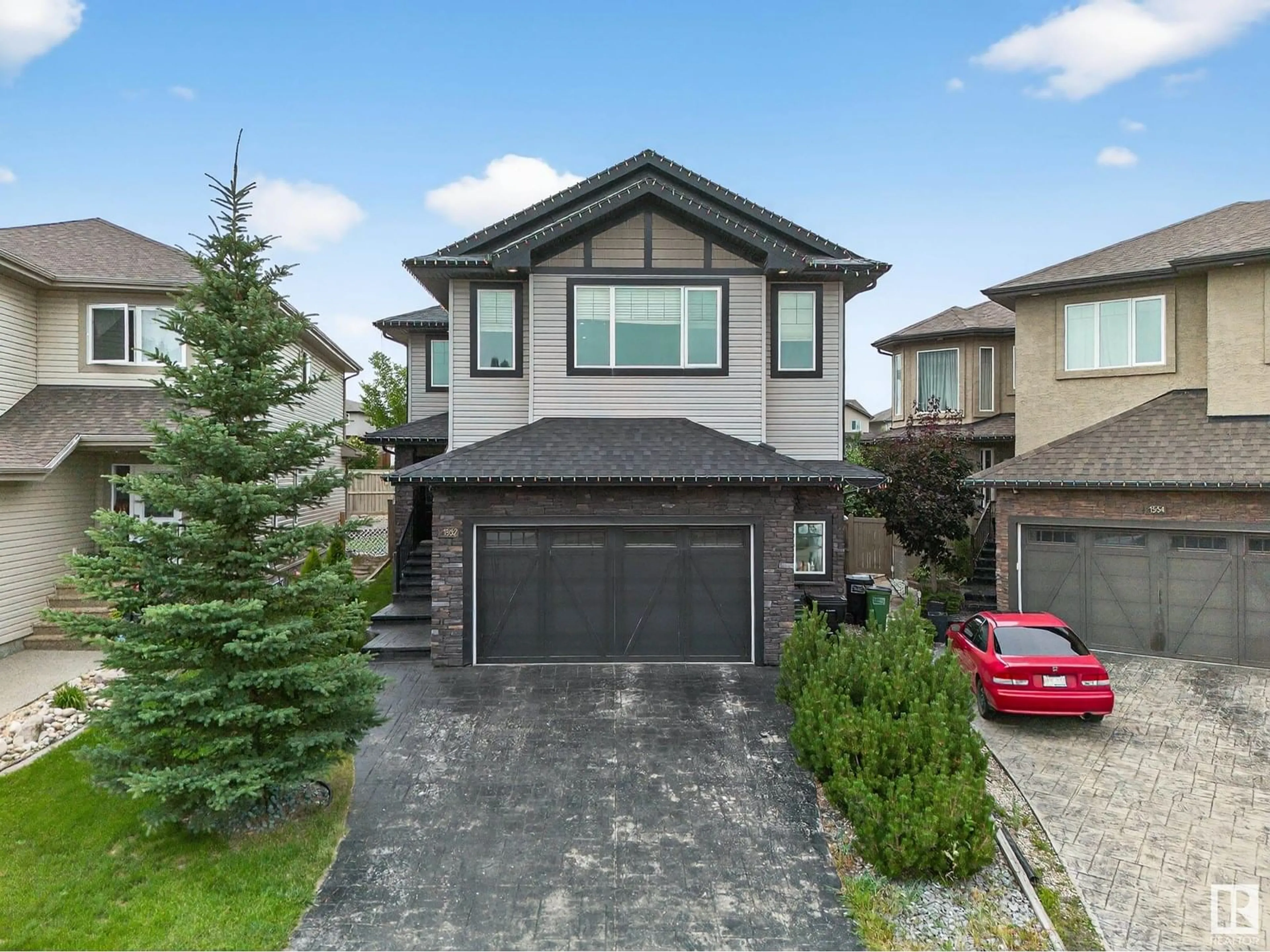 Home with brick exterior material, street for 1552 CUNNINGHAM CA SW, Edmonton Alberta T6W0Y3