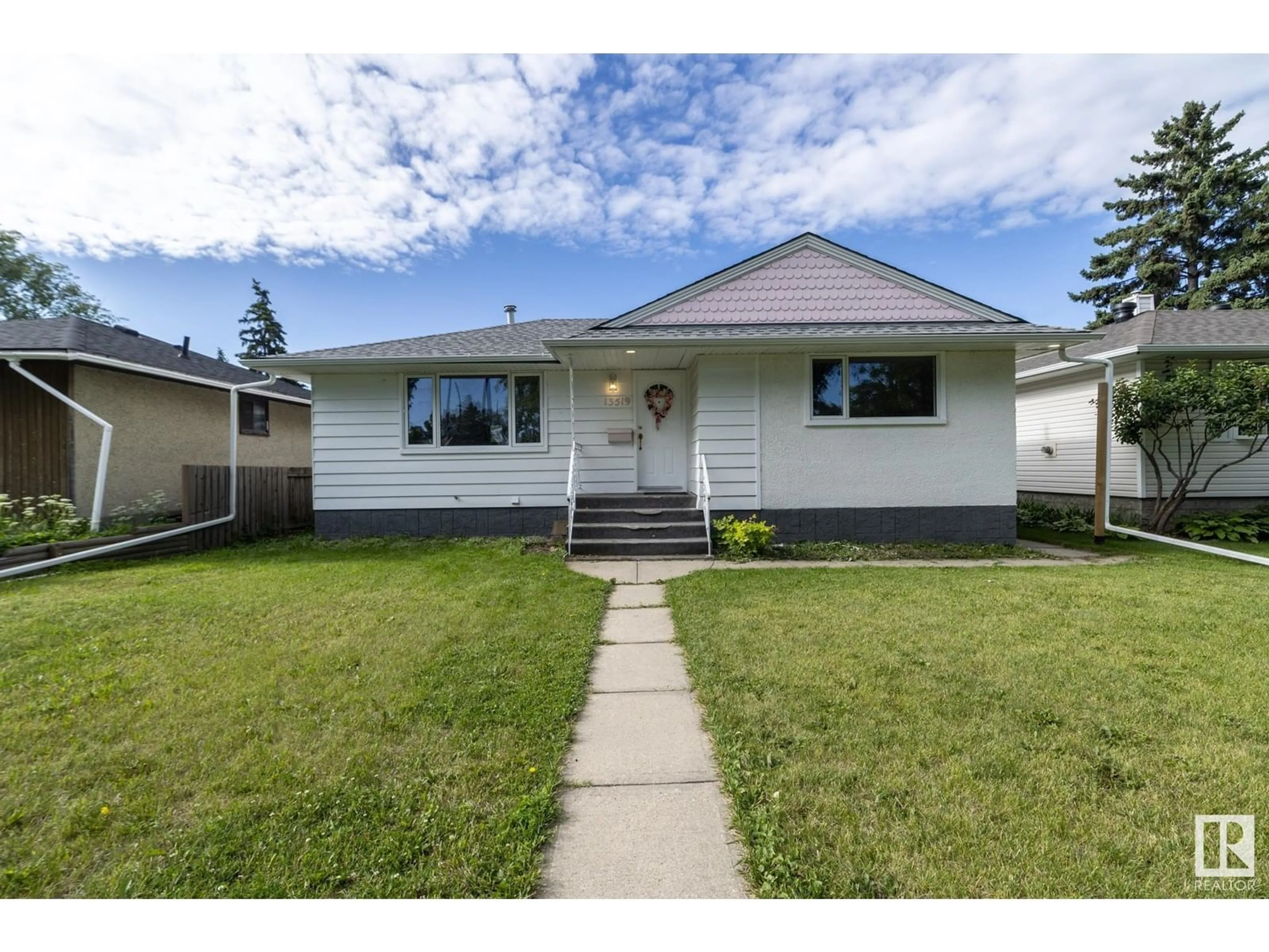 Home with vinyl exterior material, street for 13519 124 AV, Edmonton Alberta T5L3A7