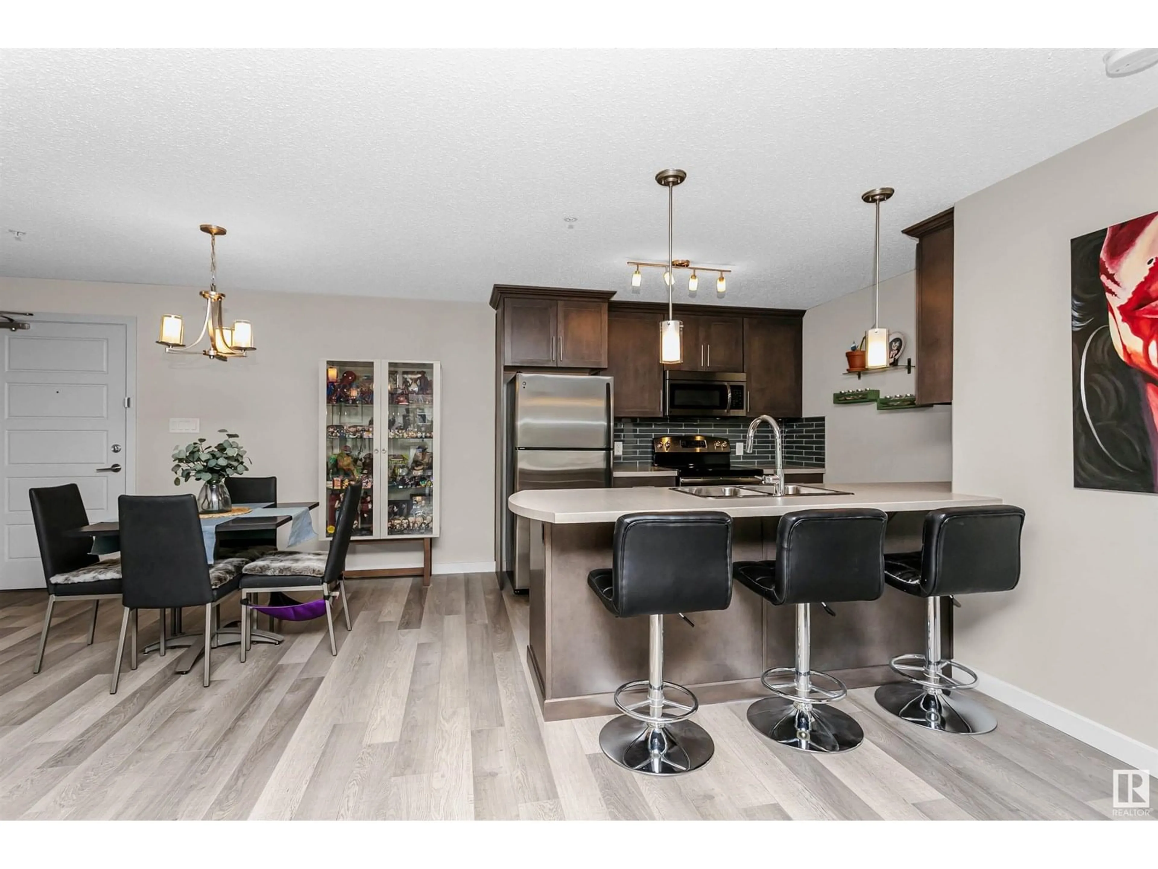 Open concept kitchen, wood/laminate floor for #356 - 7805 71 ST NW, Edmonton Alberta T5Z0K8