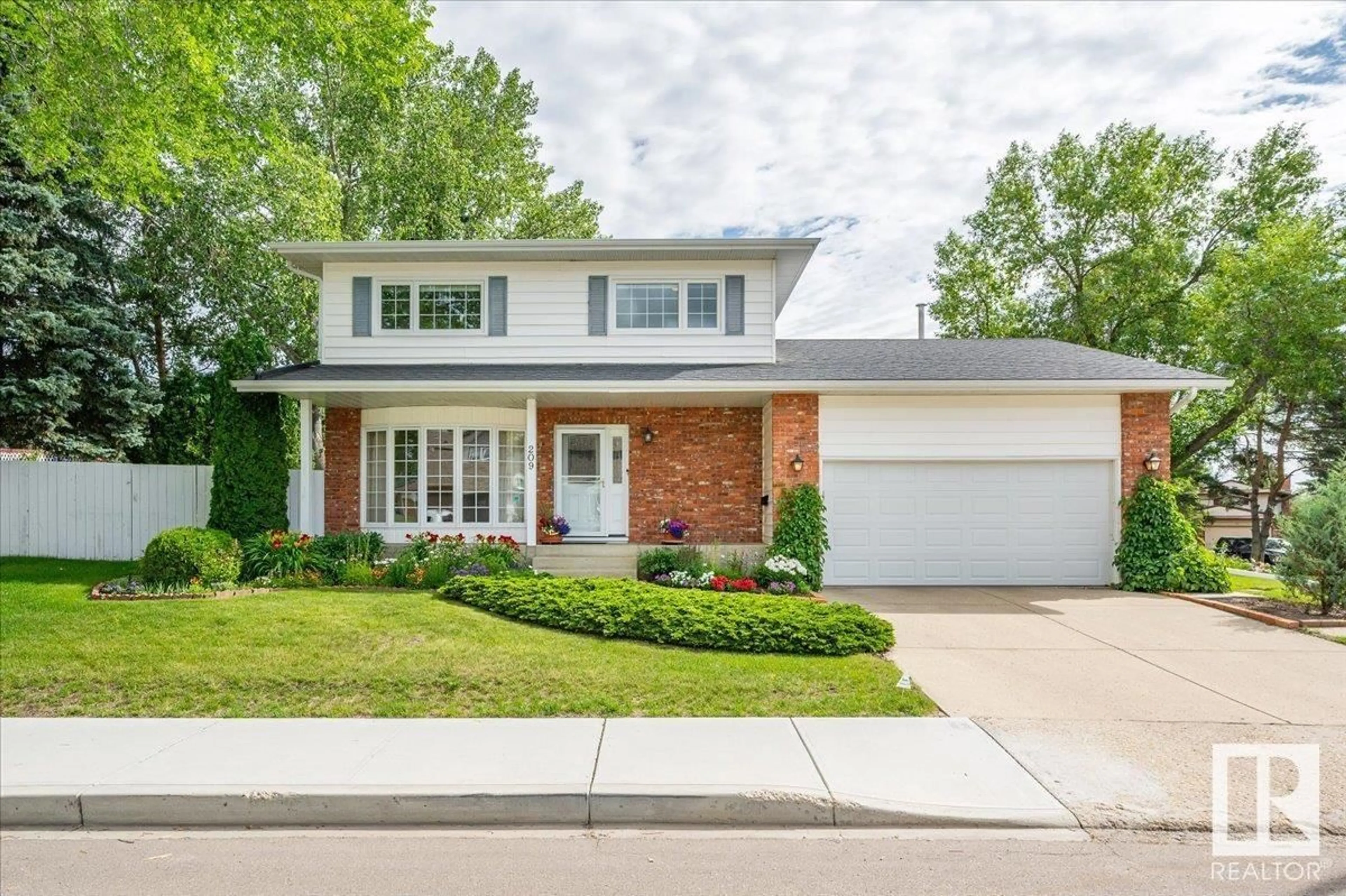 Home with brick exterior material, street for 209 RHATIGAN RD W, Edmonton Alberta T6R1A2
