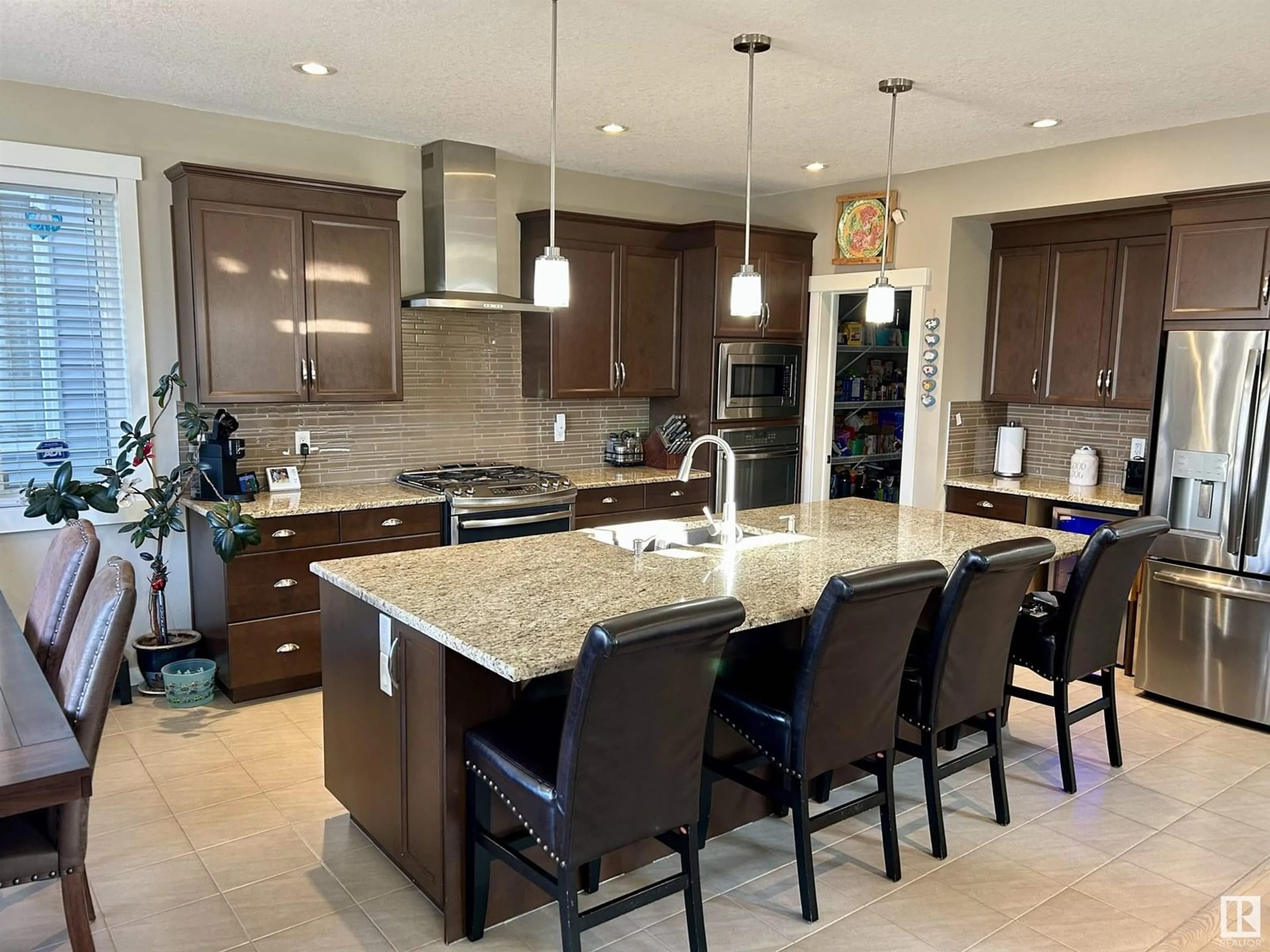 Open concept kitchen, ceramic/tile floor for 7732 19 AV, Edmonton Alberta T6X1V9