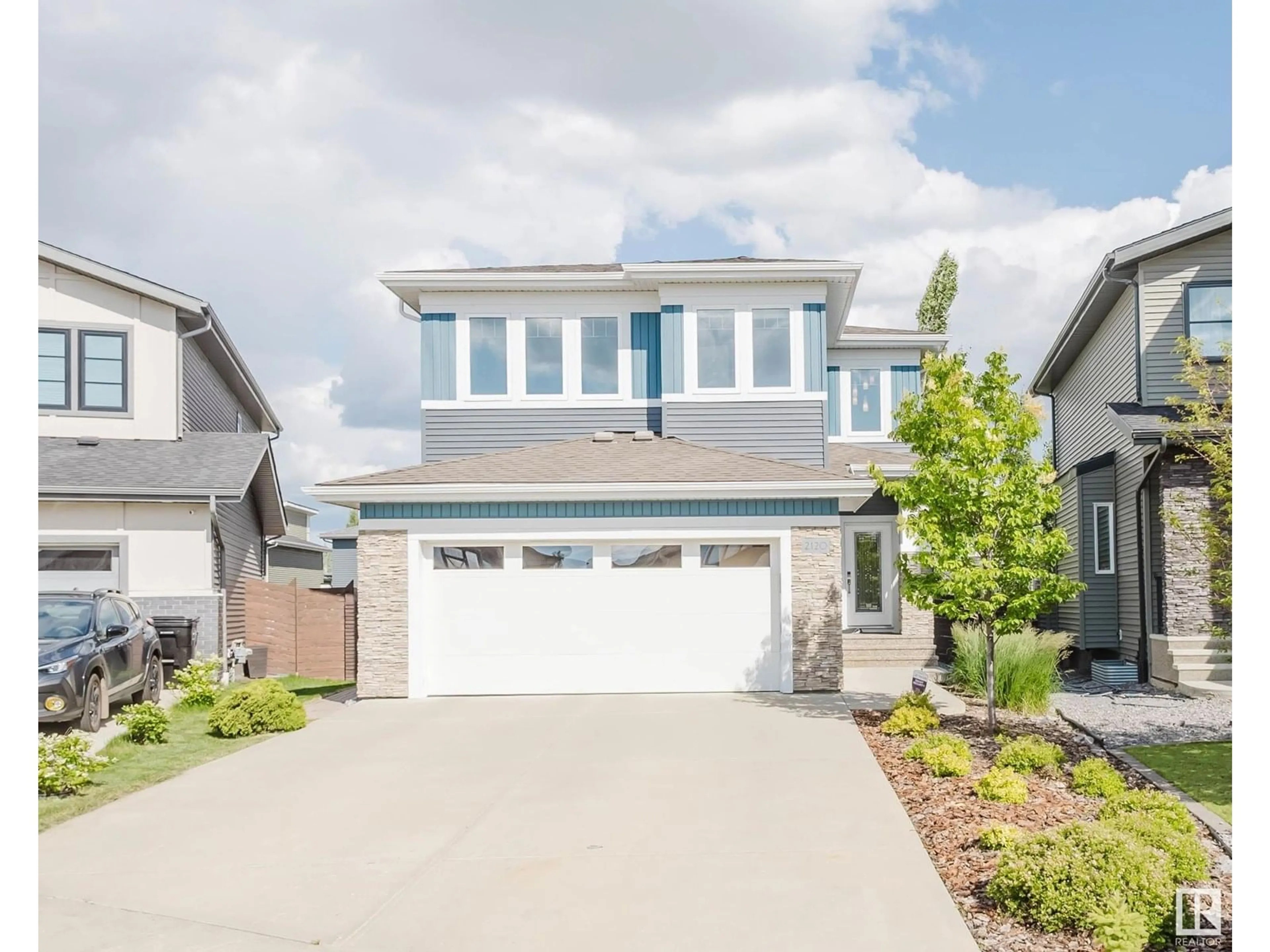 Home with vinyl exterior material, street for 2120 WARE RD, Edmonton Alberta T6W2T9