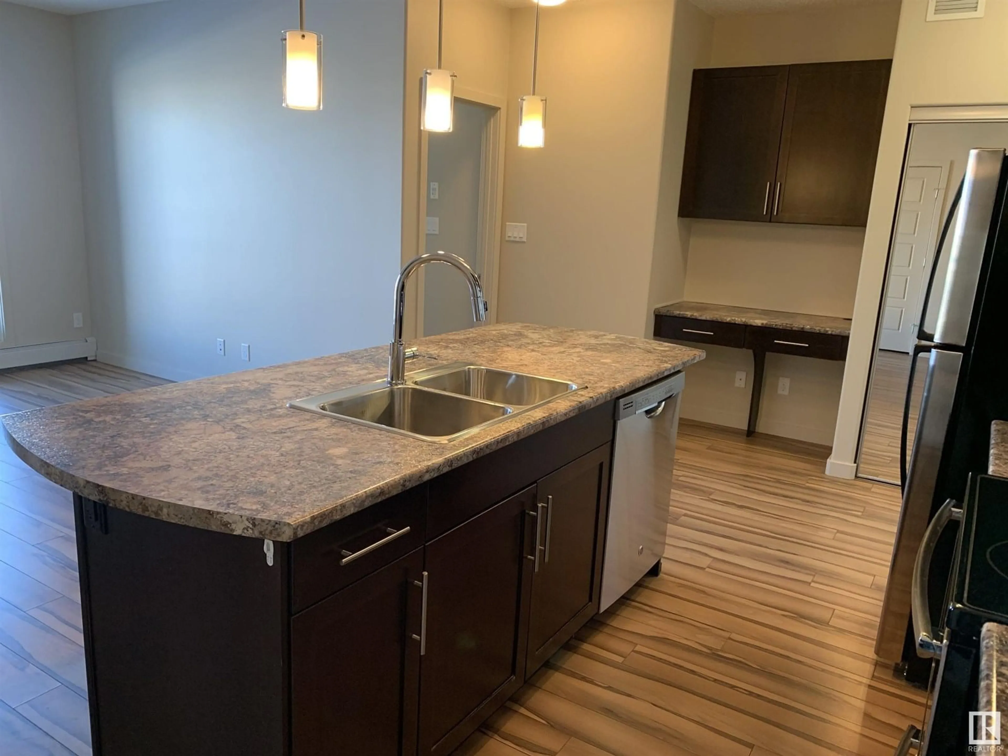 Open concept kitchen, wood/laminate floor for 317 - 1144 ADAMSON DR, Edmonton Alberta T6W2X7
